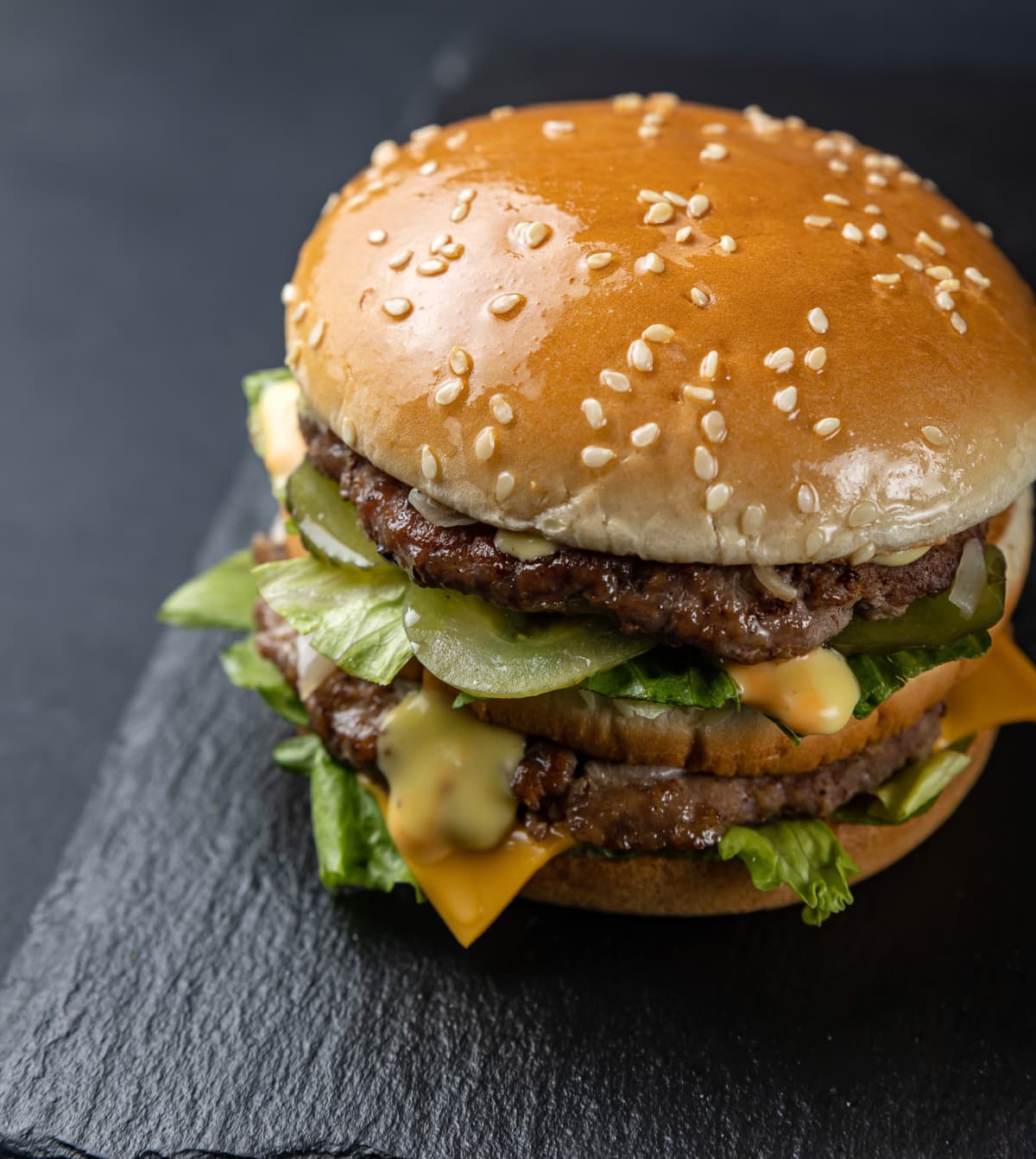 delicious hamburger made of chicken meat, cheese, cucumbers in fast food