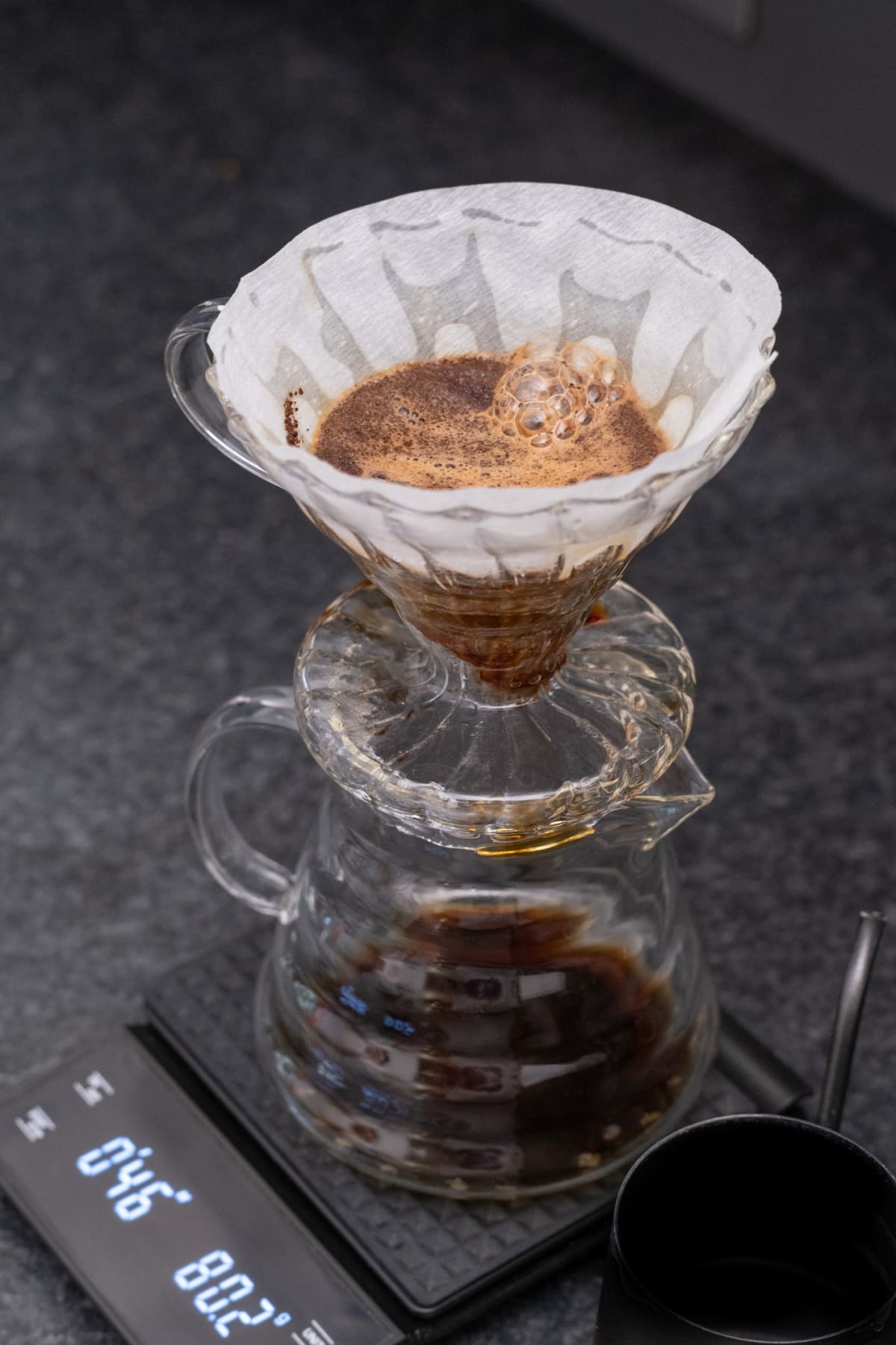 Pour-over coffee maker on a kitchen scale