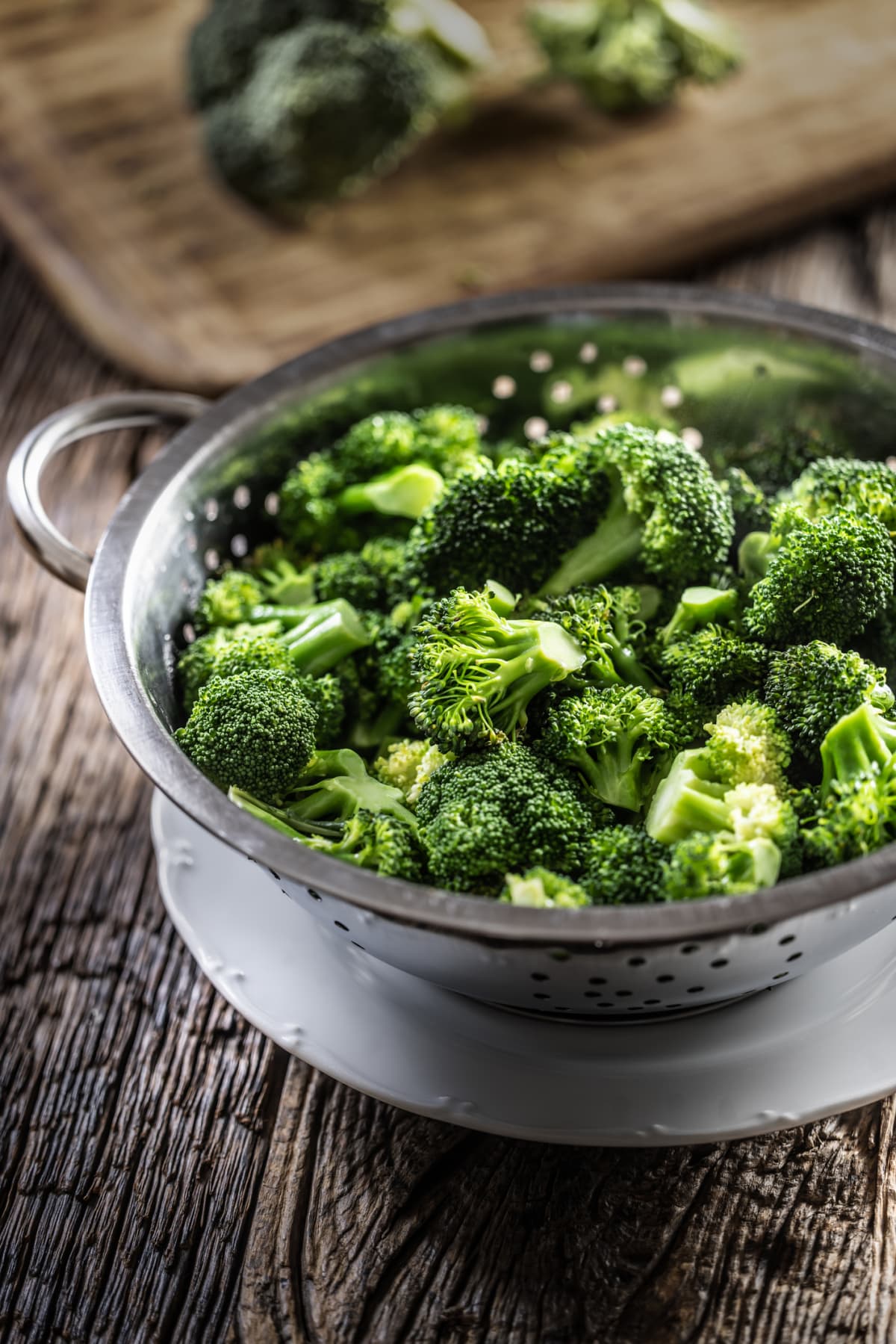 Steamed broccoli in a stainless steel steamer