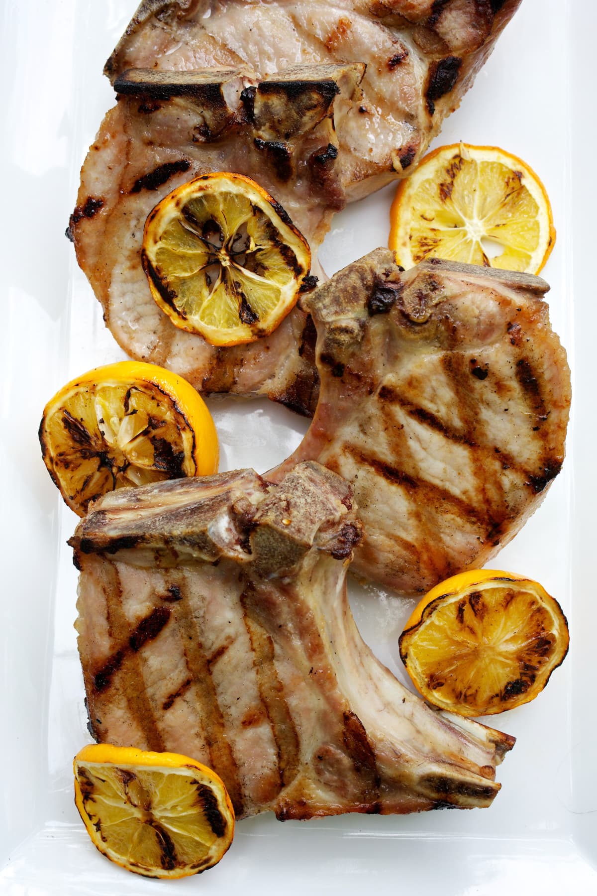 Pork chops with grilled lemon slices