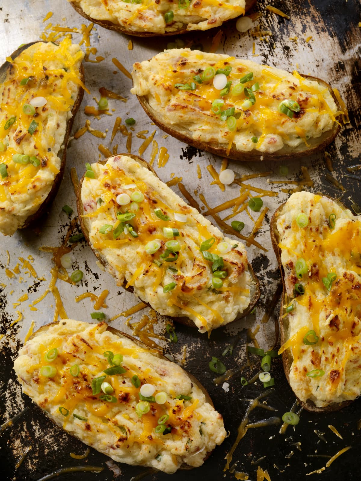 Baked potatoes stuffed with tuna, cheese, and scallions