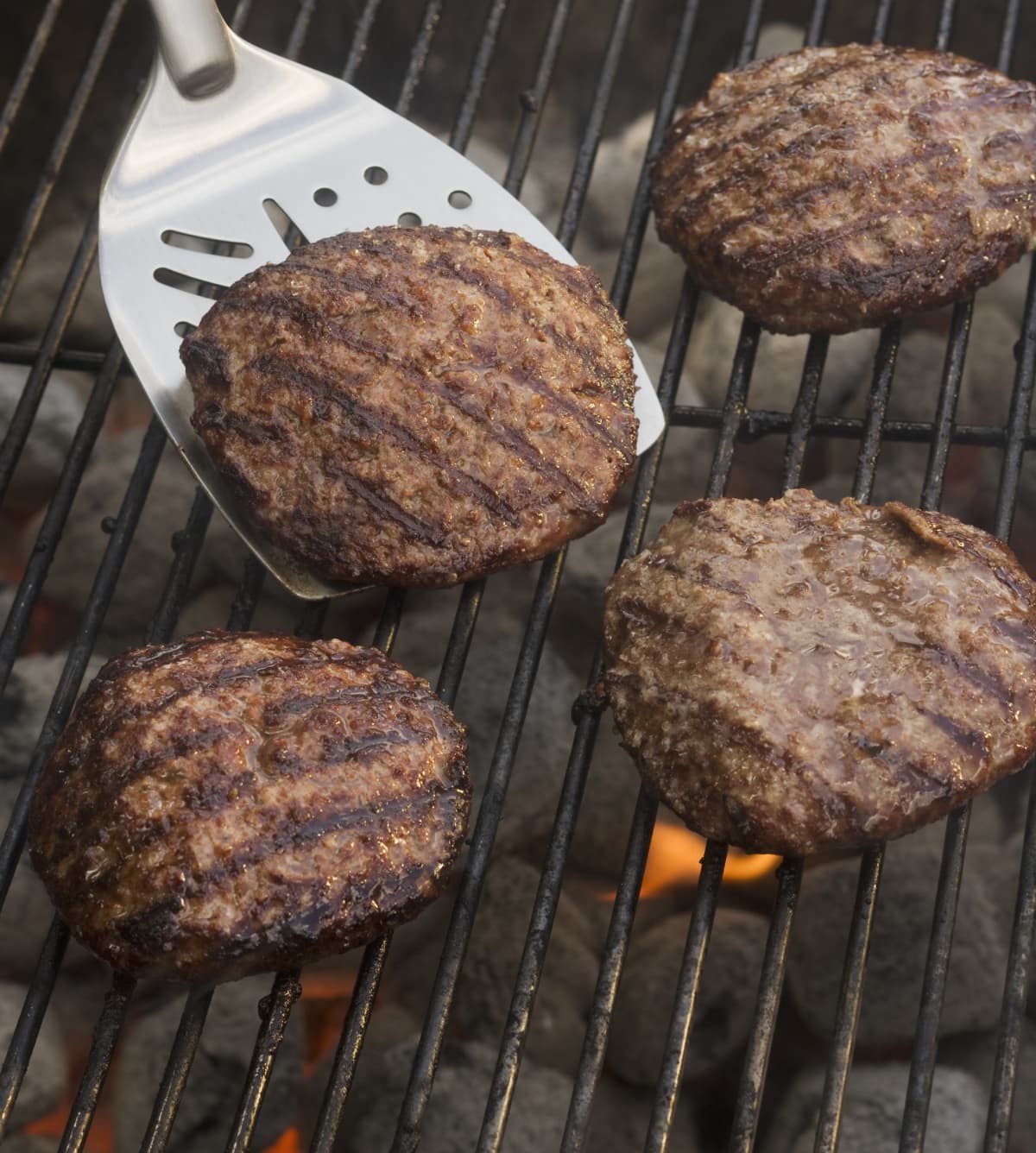 Burgers being grilled on the barbecue