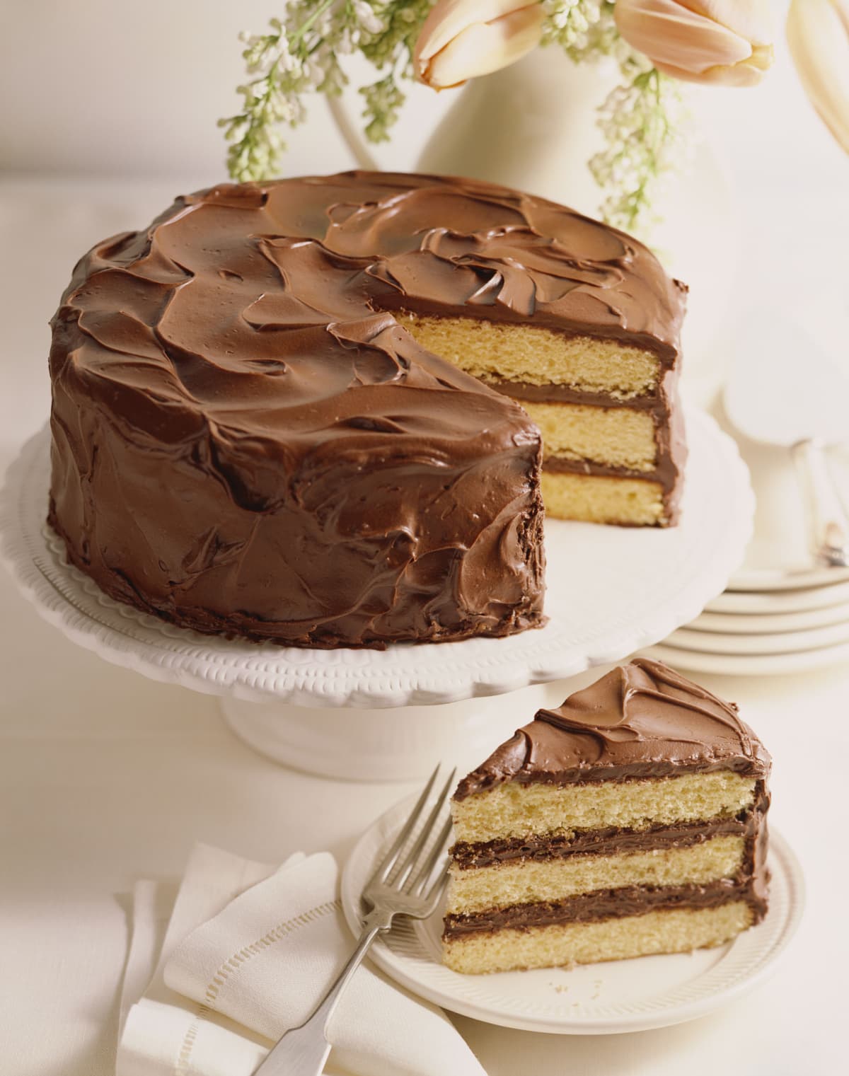 Three layer yellow cake with chocolate frosting