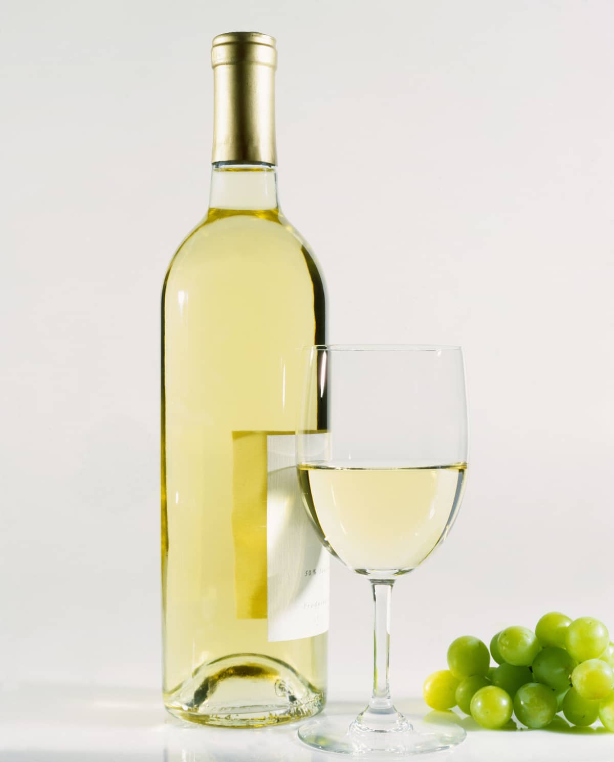Wine bottle and wine glass on white backround