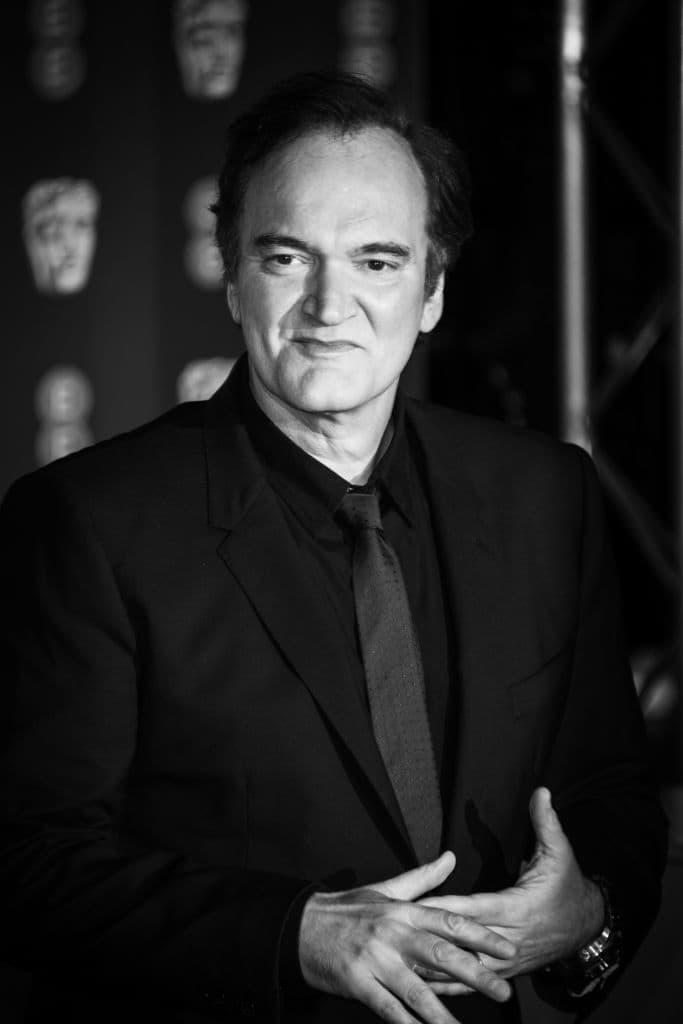 LONDON, ENGLAND - FEBRUARY 02: (EDITORS NOTE: Image has been converted to black and white) Quentin Tarantino attends the EE British Academy Film Awards 2020 at Royal Albert Hall on February 02, 2020 in London, England. (Photo by Gareth Cattermole/Getty Images)