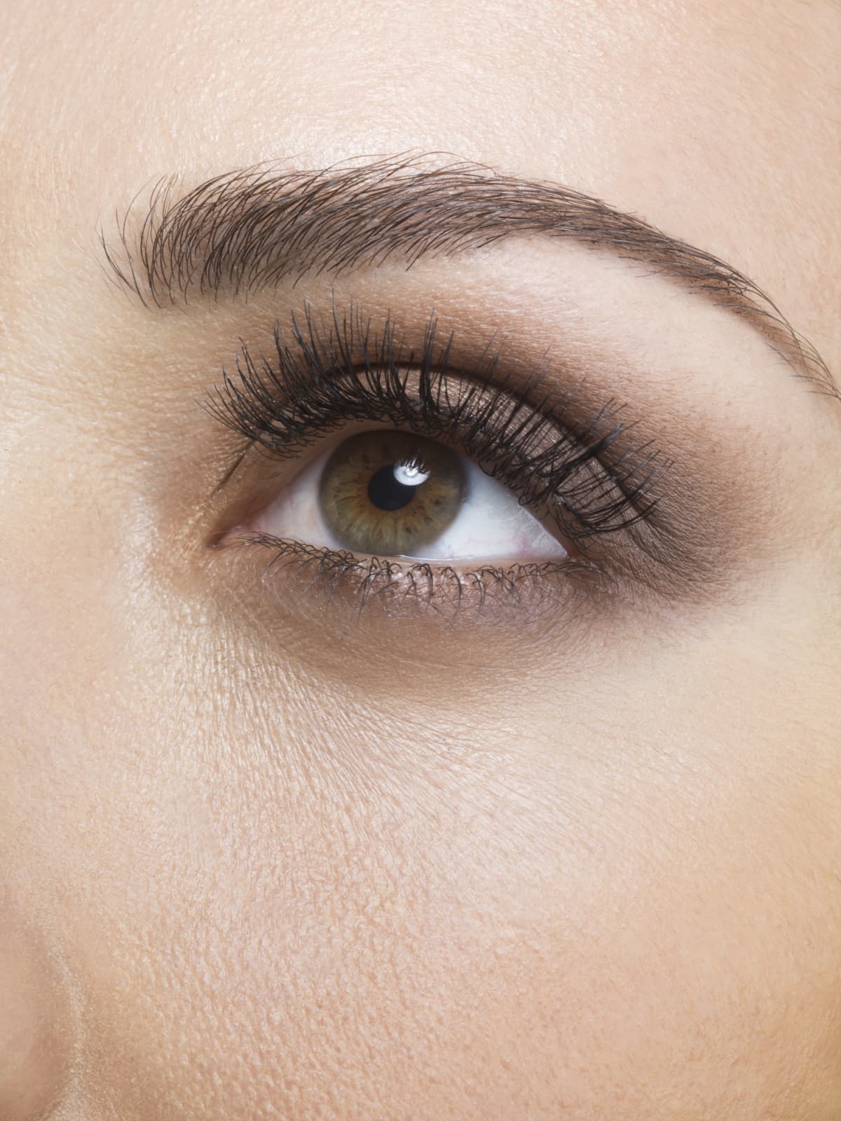 Close up of a hazel eye with long lashes