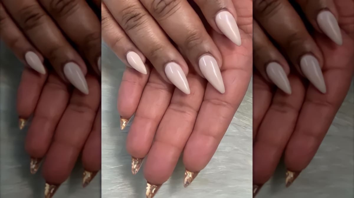 Two hands with peekaboo nails