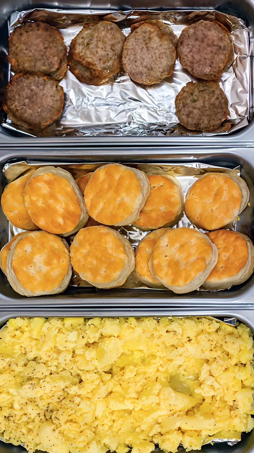 Sausage, biscuits, and eggs in aluminum containers 