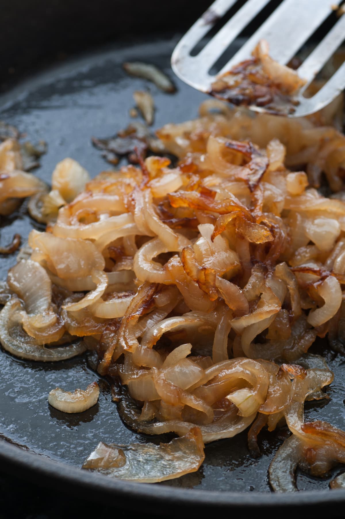 Caramelized onion in a frying pan.