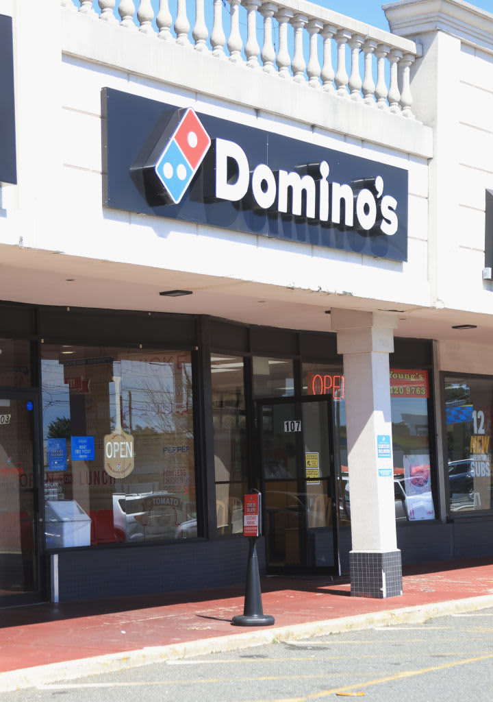 FARMINGDALE, NEW YORK - SEPTEMBER 15: A general view of a Domino's restaurant on September 15, 2022 in Farmingdale, New York, United States. Many families along with businesses are suffering the effects of inflation as the economy is dictating a change in spending habits. (Photo by Bruce Bennett/Getty Images)