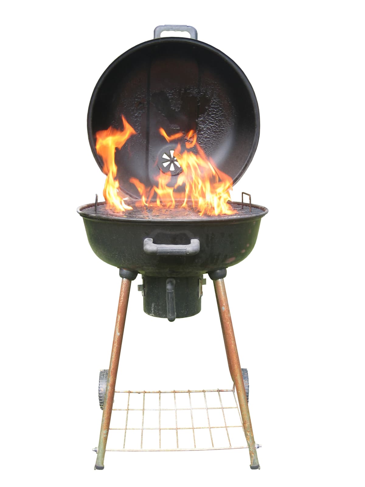 A barbecue grill with flames.
