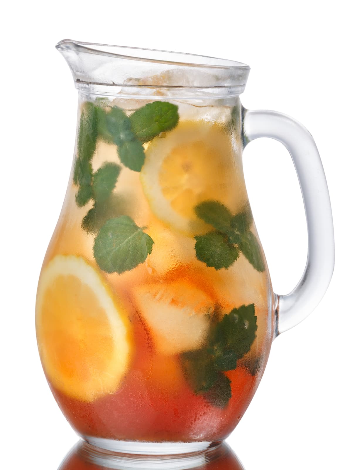 Pitcher of iced tea with mint and lemon.