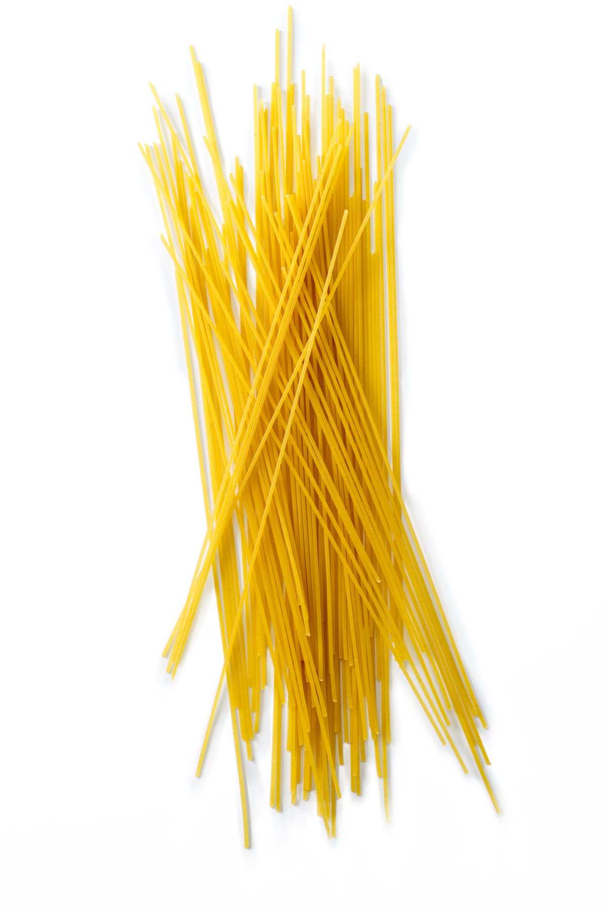 Uncooked spaghetti isolated on white background