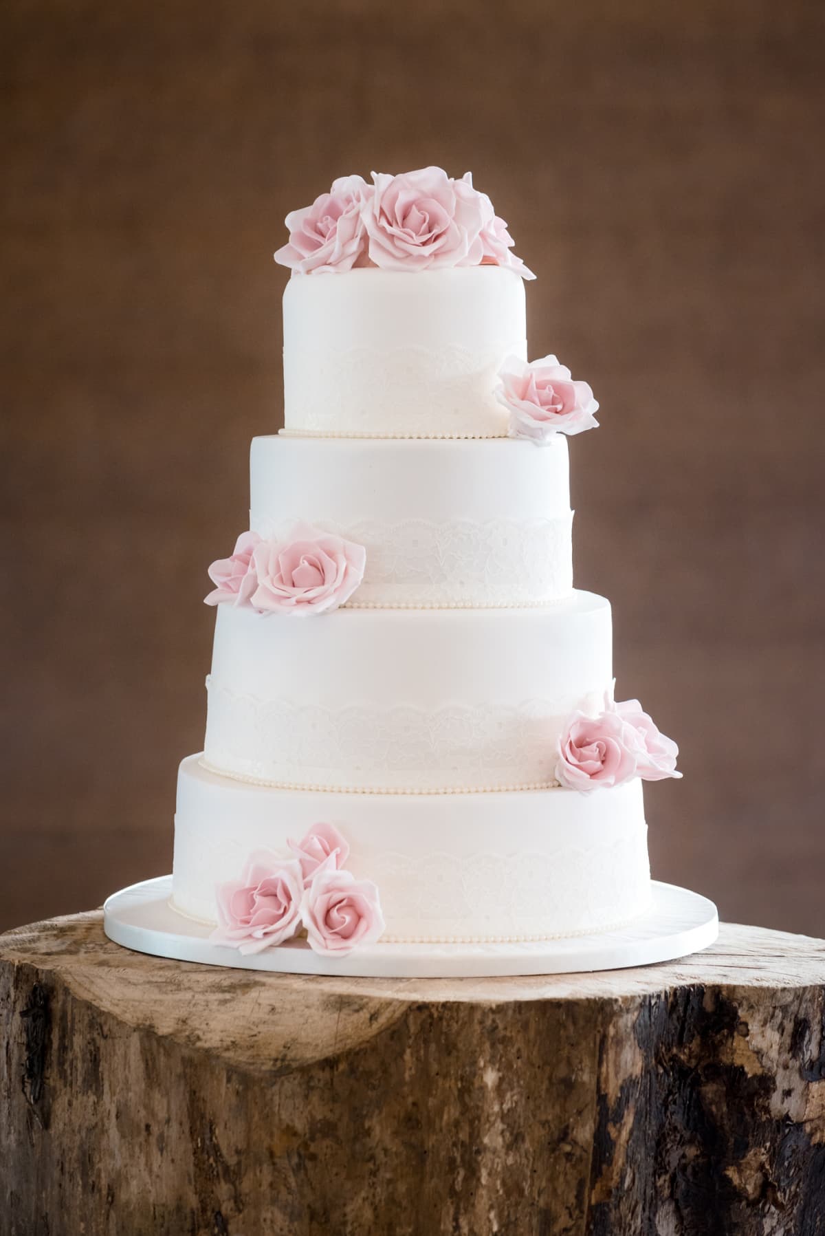 White wedding cake with pink flowers