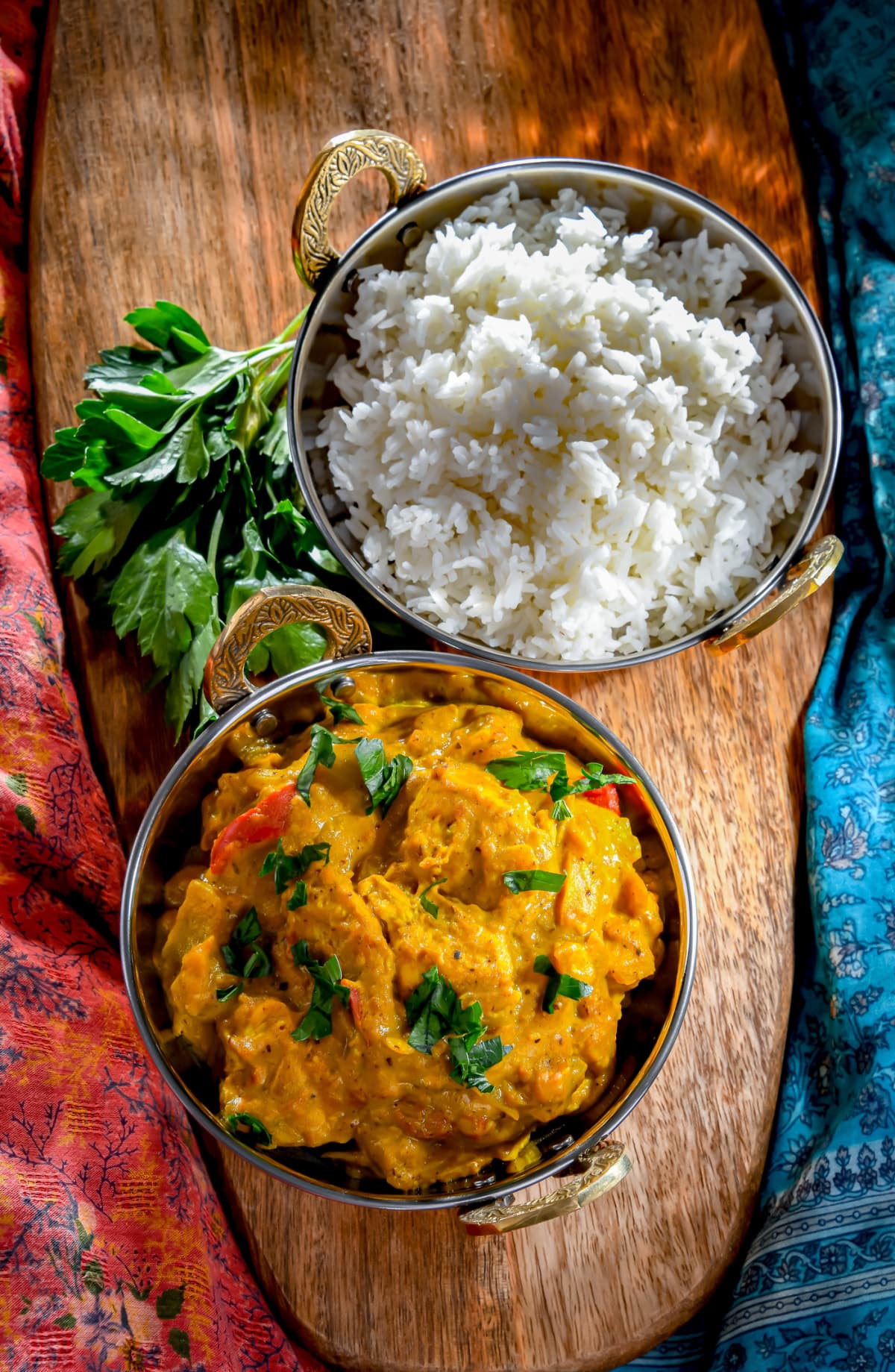 Curry chicken with rice served in original indian karahi pots.