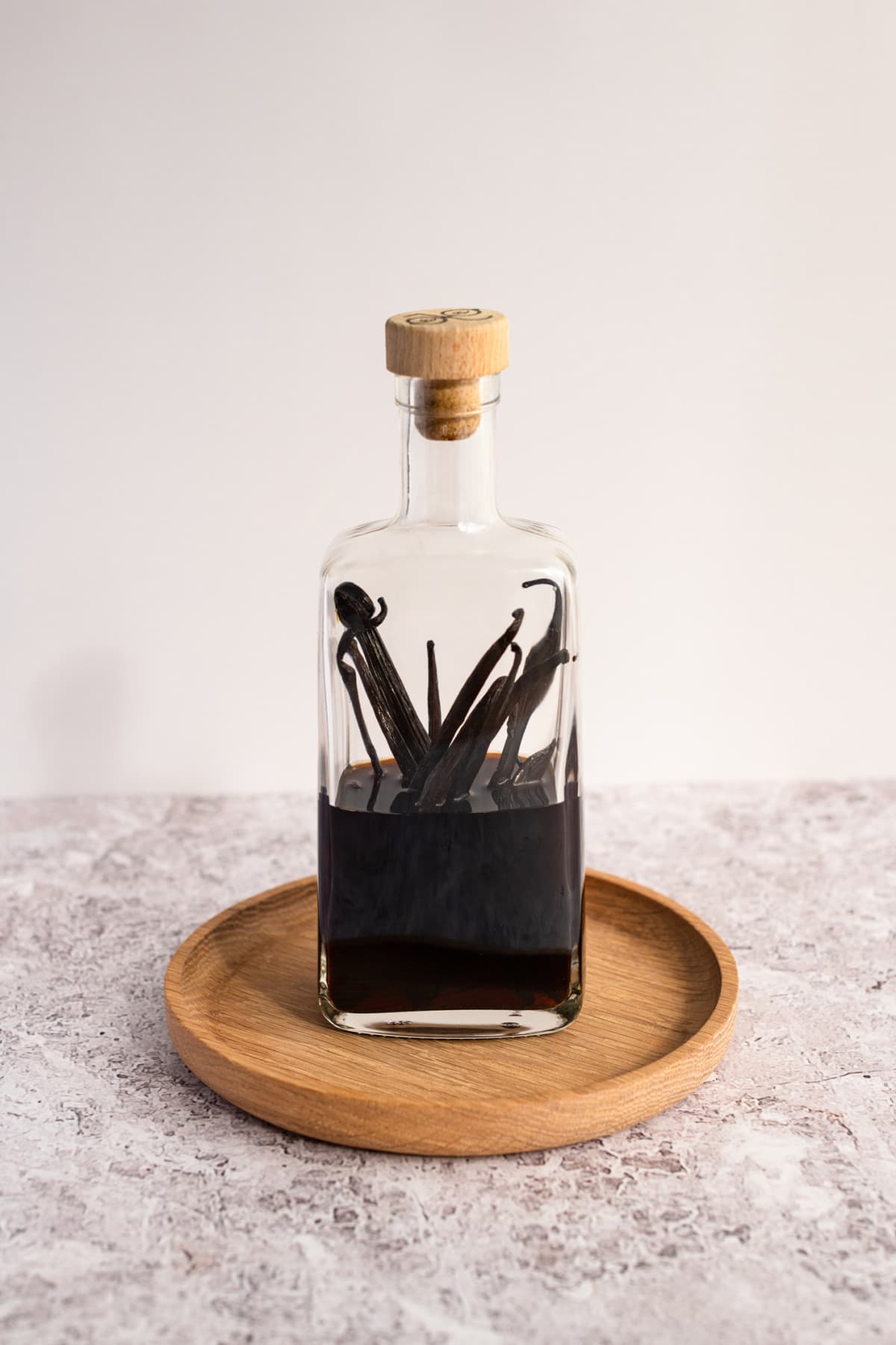 A closeup of homemade organic vanilla extract in a bottle