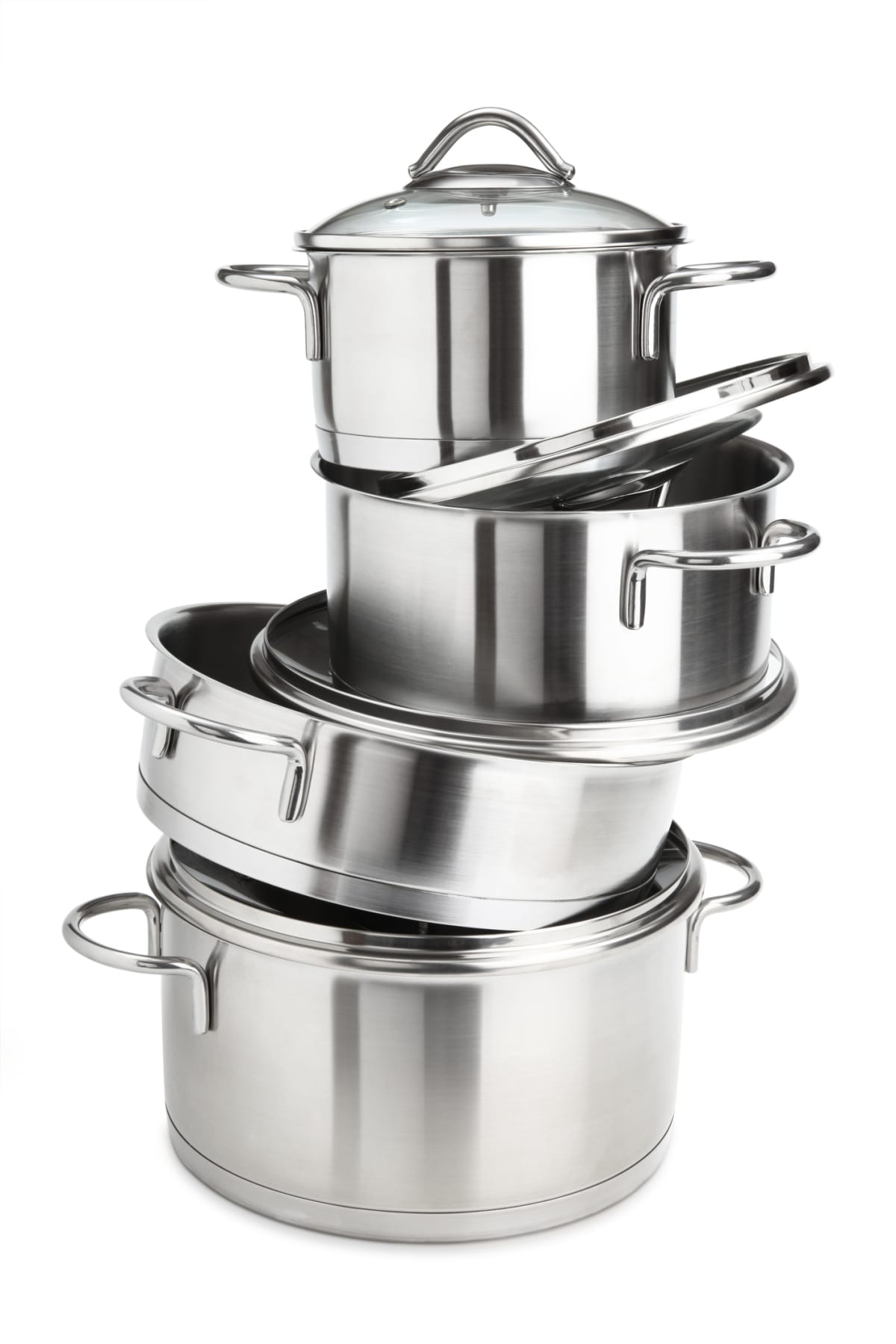 A stack of stainless-steel saucepans on white background.