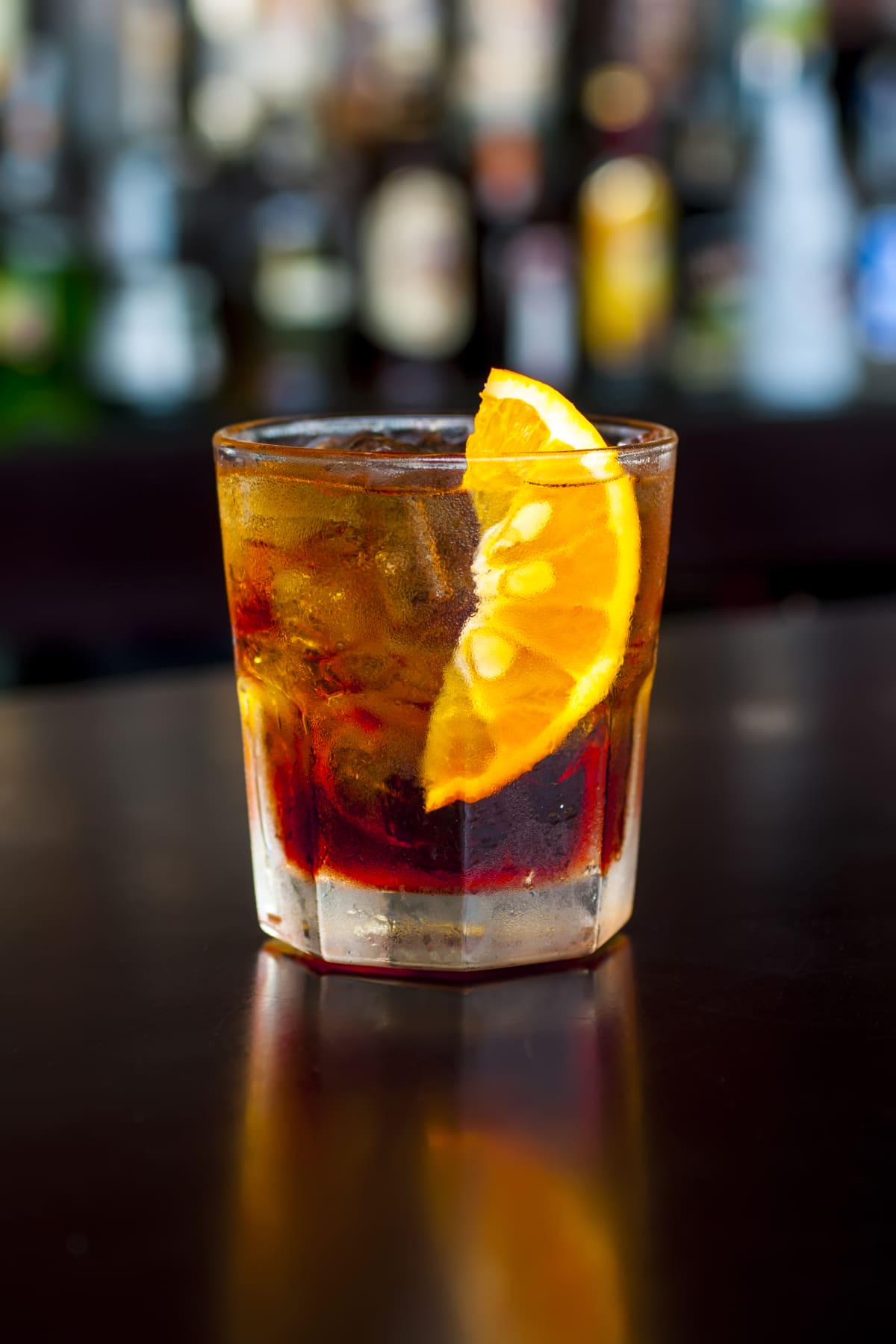 Negroni, an unforgivable IBA (international bartender association) cocktail, with 1/3 gin, 1/3 bitter, 1/3 vermut (or vermouth), in colorful and rich contemporary style. Also Americano cocktail.