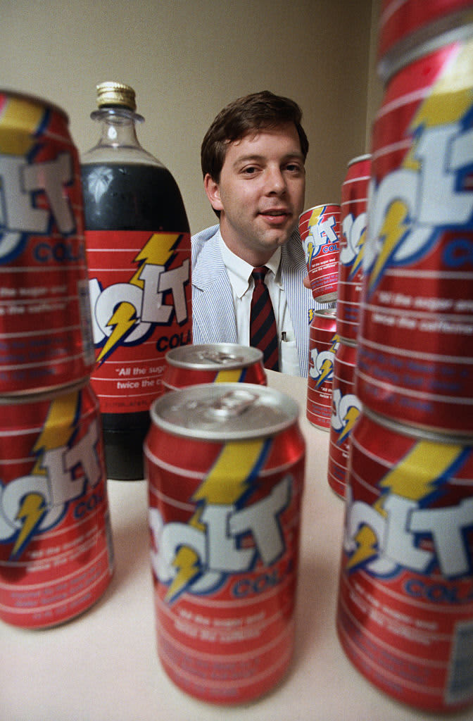 (Original Caption) New Orleans: C. J. Rapp of Rochester, New York, hoists a can of his invention, Jolt Cola, advertised as twice the caffeine and all the sugar as in your other cola, as he visited a new distributor in New Orleans. His sneaky, imaginative assault on the giant cola companies is bolstered with his tour thru sugar growing areas.