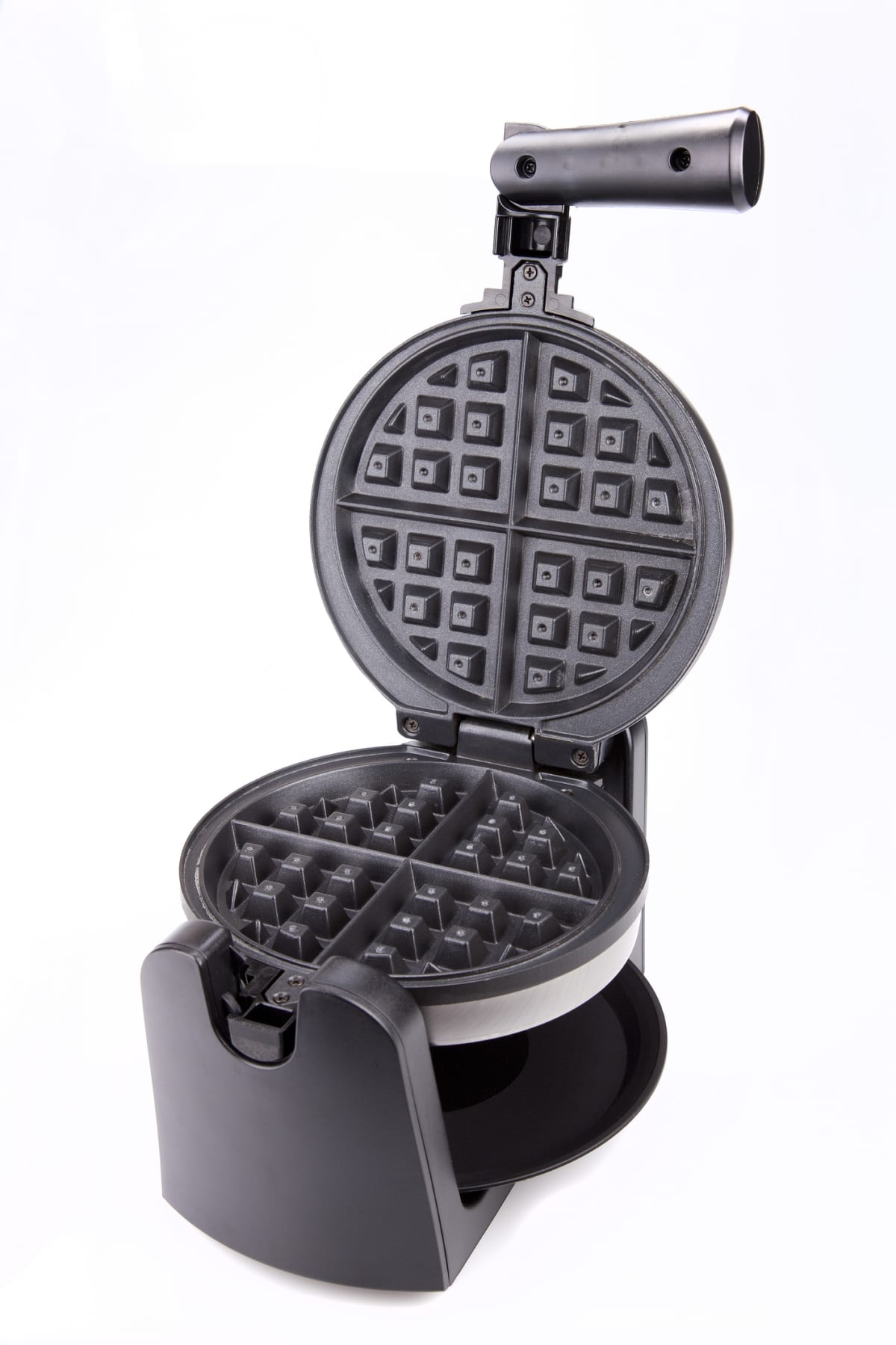 Stainless steel waffle maker on a white surface. Waffle maker isolated on white background.