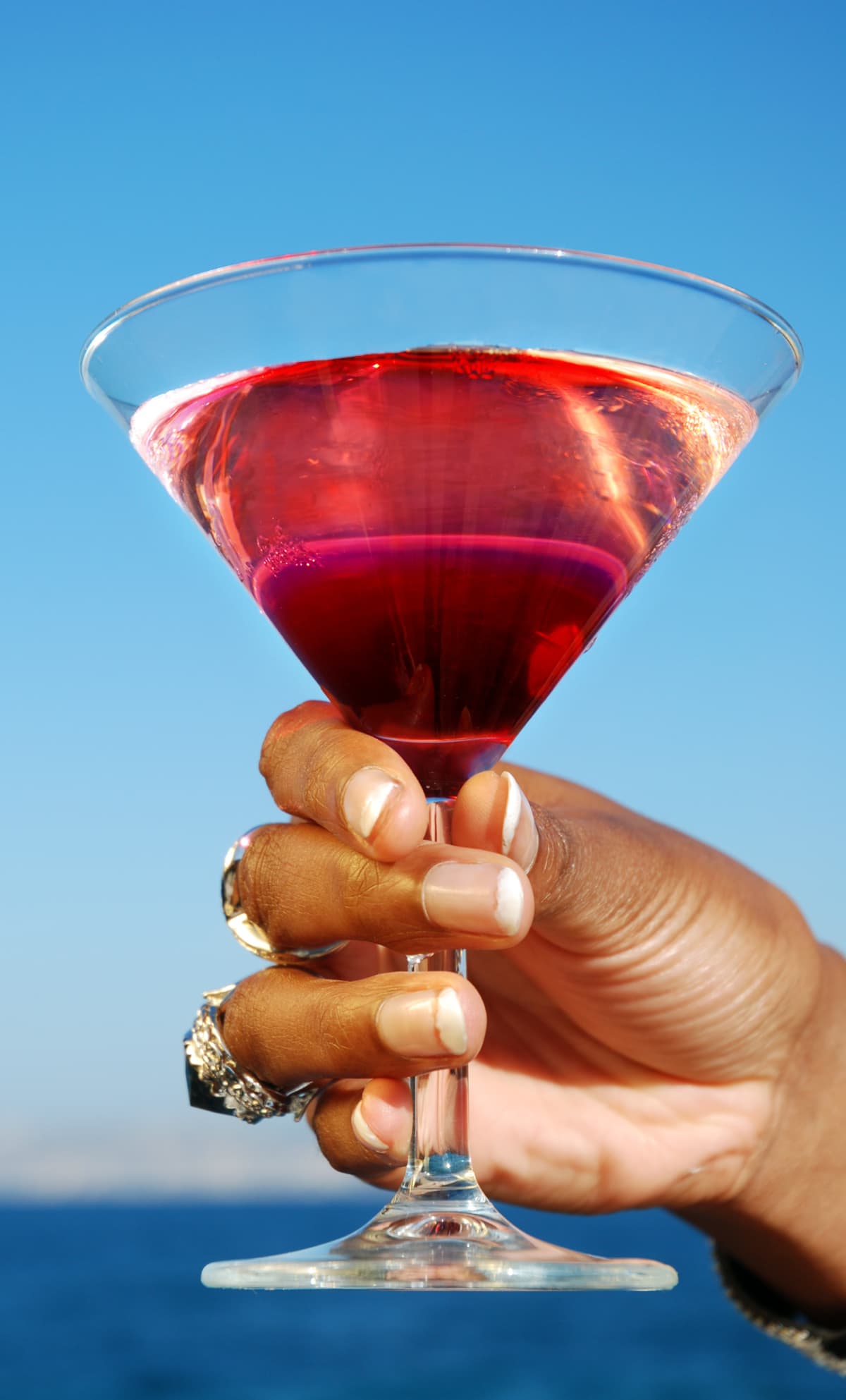 maraschino cherry martini cocktail drink glass on bar