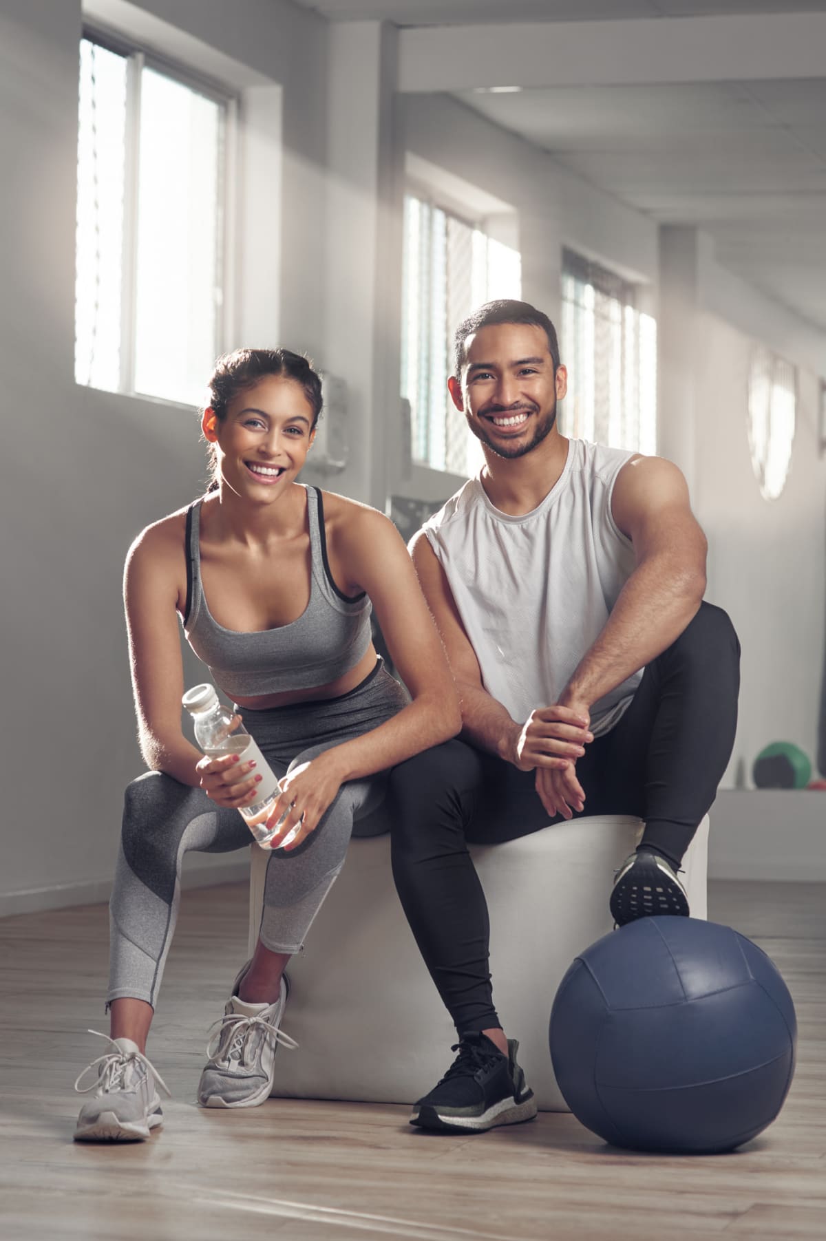 young smiling couple in a gym