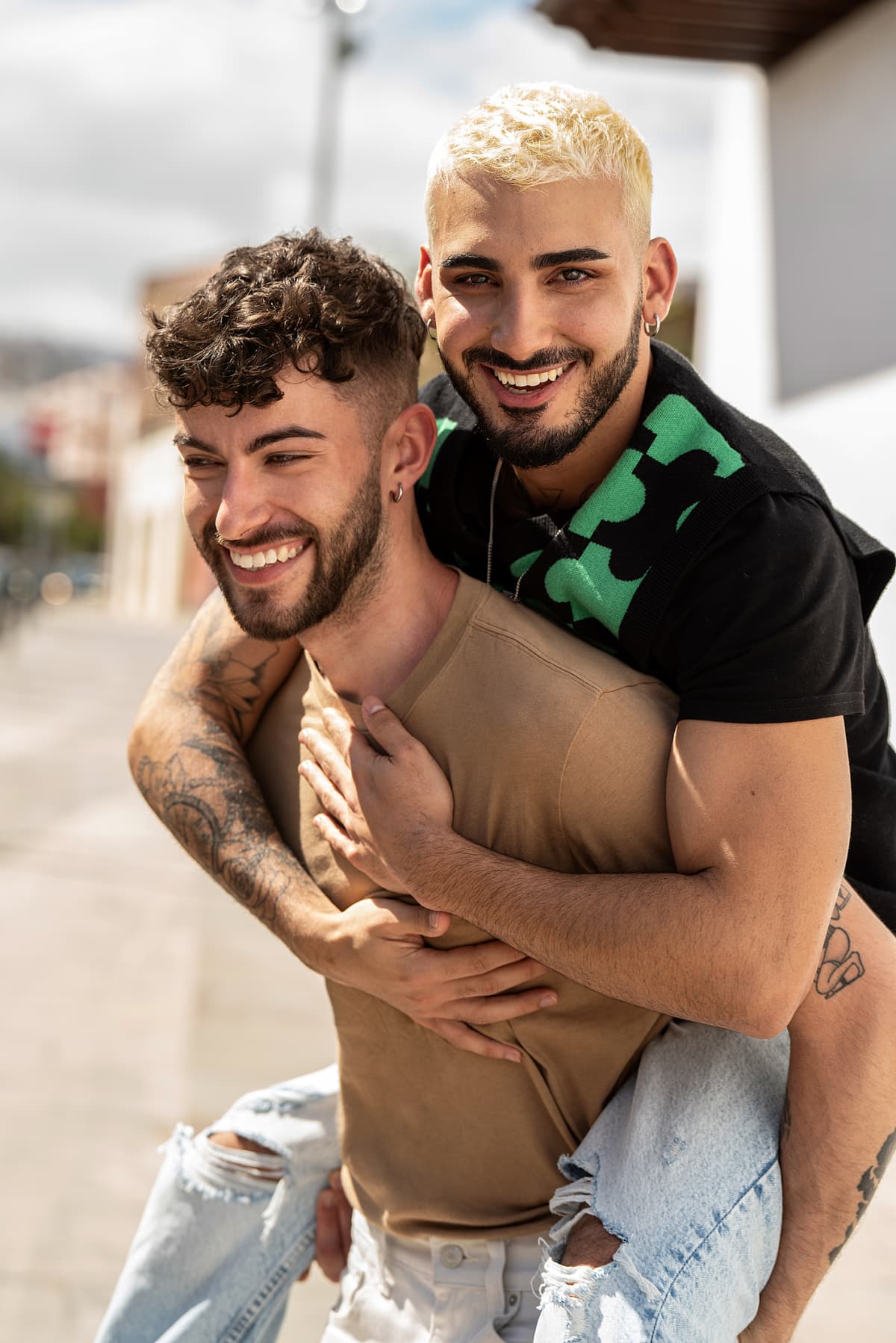 Man carrying his boyfriend on his back