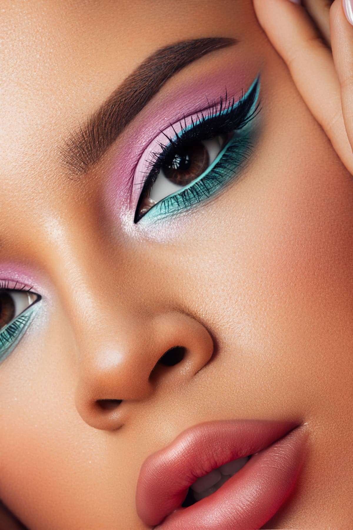 woman with pink and blue eye makeup