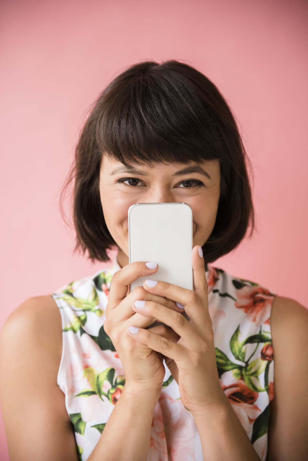 a woman holding her phone in front of her face