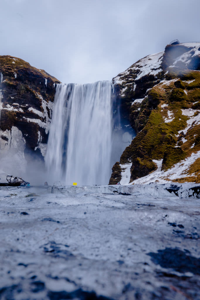 A view of the Skógafoss Waterfall In Skogar, Iceland, on January 24, 2023. Skógafoss is one of Iceland's biggest and most beautiful waterfalls with an astounding width of 25 meters (82 feet) and a drop of 60 meters (197 feet). (Photo by Manuel Romano/NurPhoto via Getty Images)
