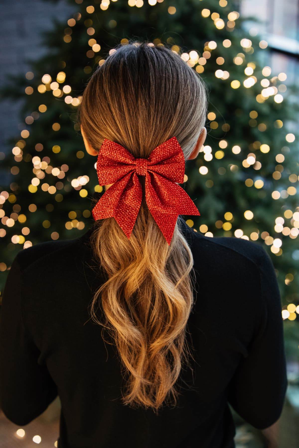 Girl with long blondie hair and red bow hair