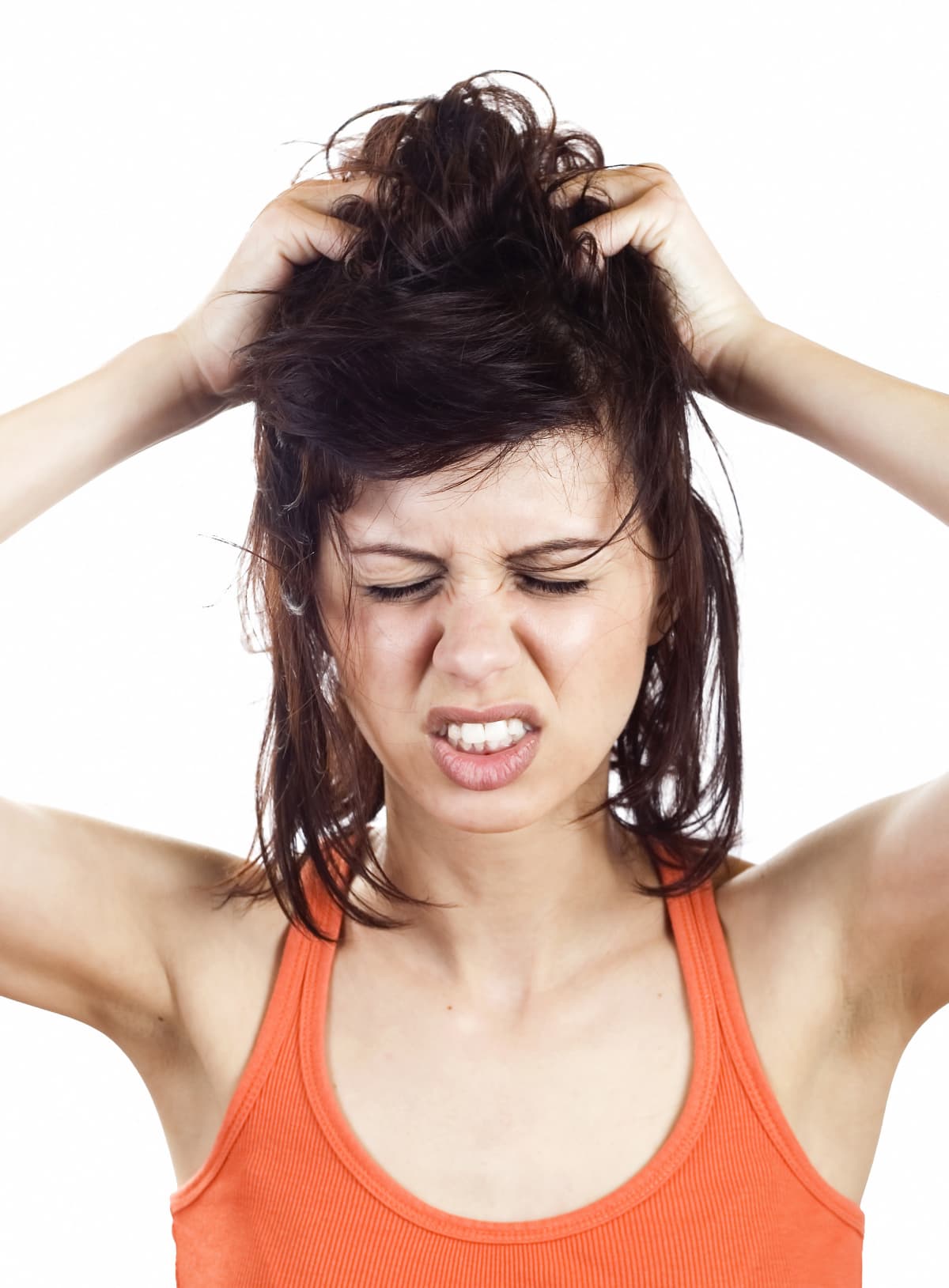 a woman scratching her scalp