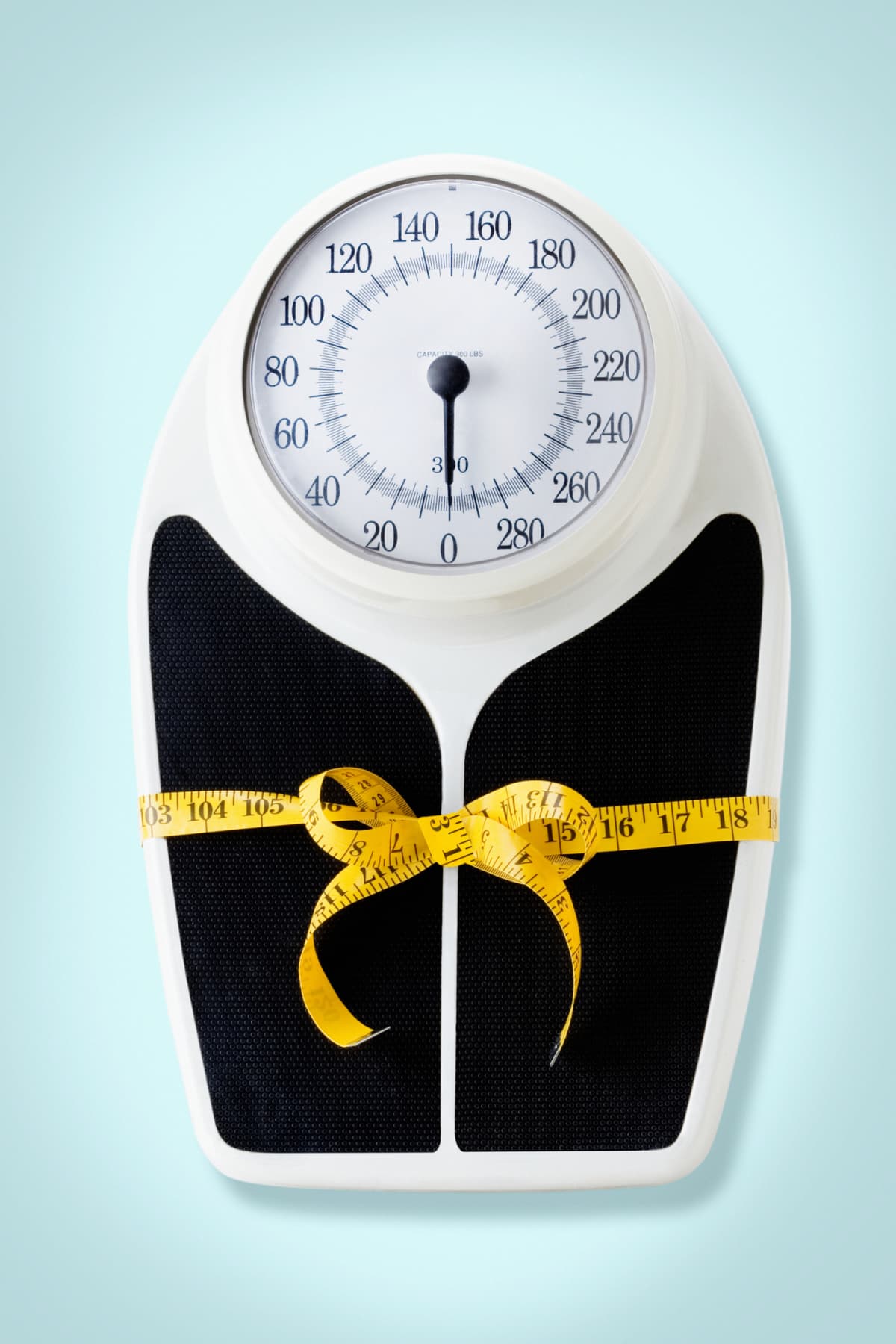 A scale with a tape measure on it