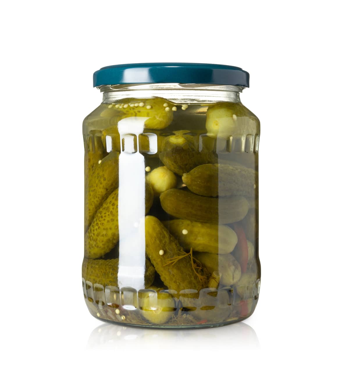 A jar of pickles with a blue lid against a white background