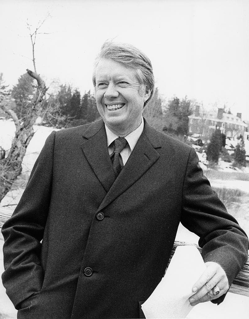 Presidential candidate Jimmy Carter prepares to be filmed for a political ad on the North Bridge in Concord, Massachusetts, 1976. (photo by Mikki Ansin/Getty Images)