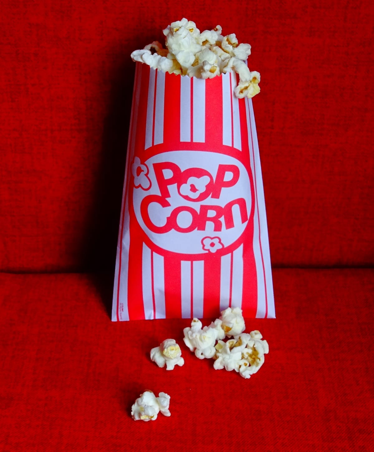 Close-Up Of Popcorn On Red Seat
