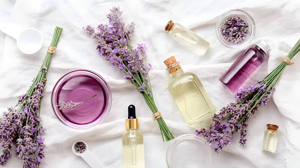 Bottles of essential oils and lavender flowers