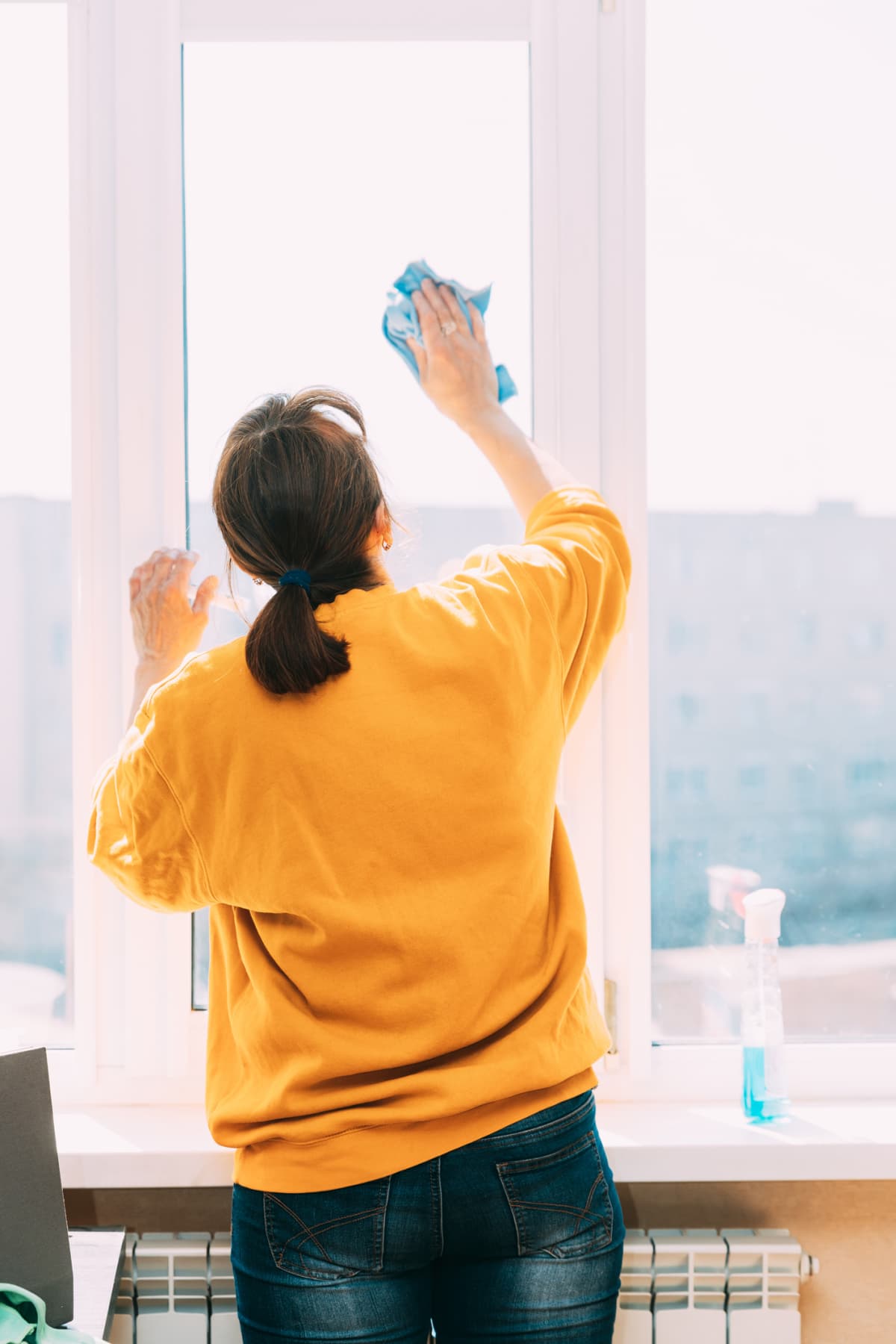 A woman cleaning her windows