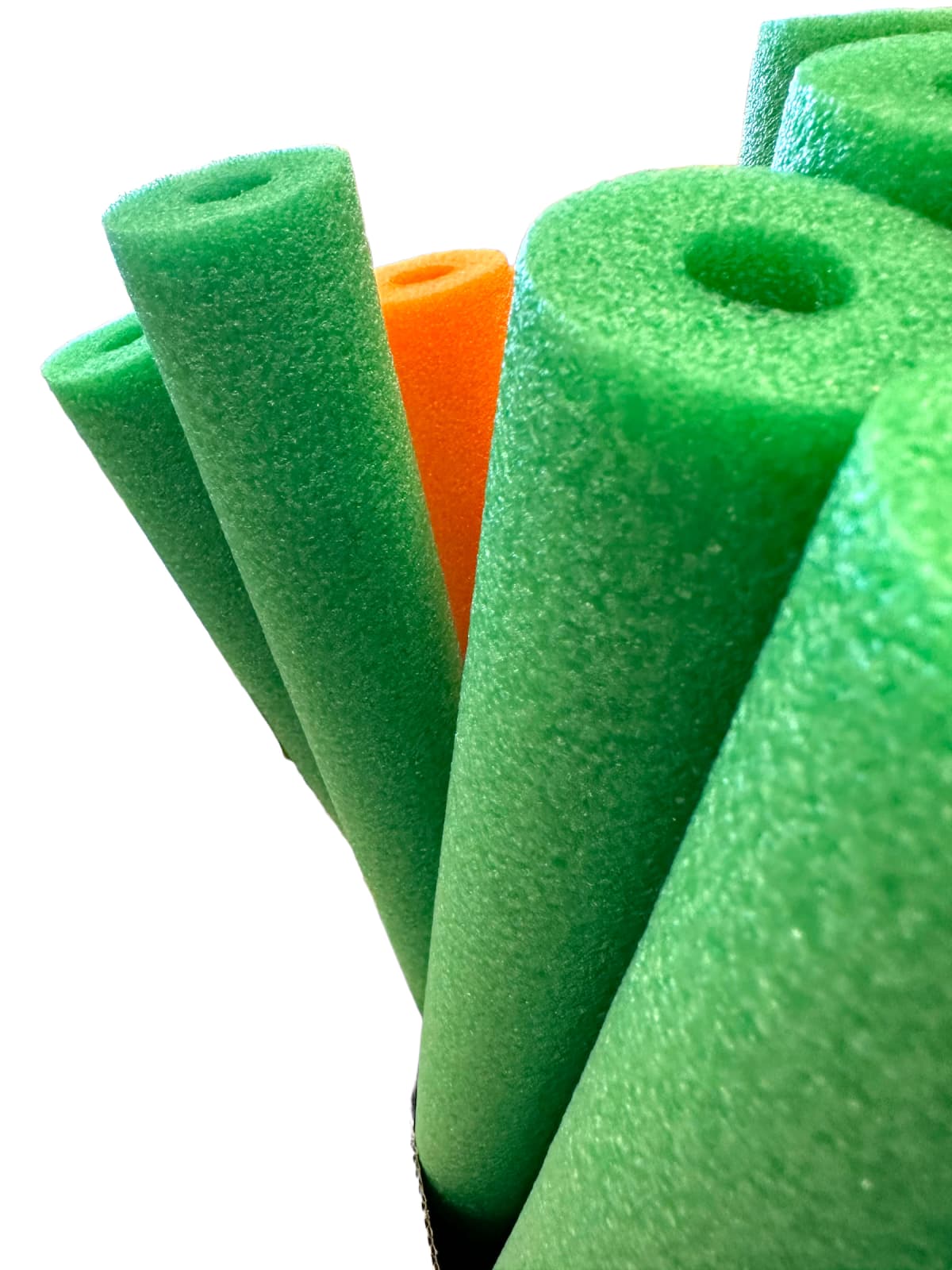 Green pool noodles against white background