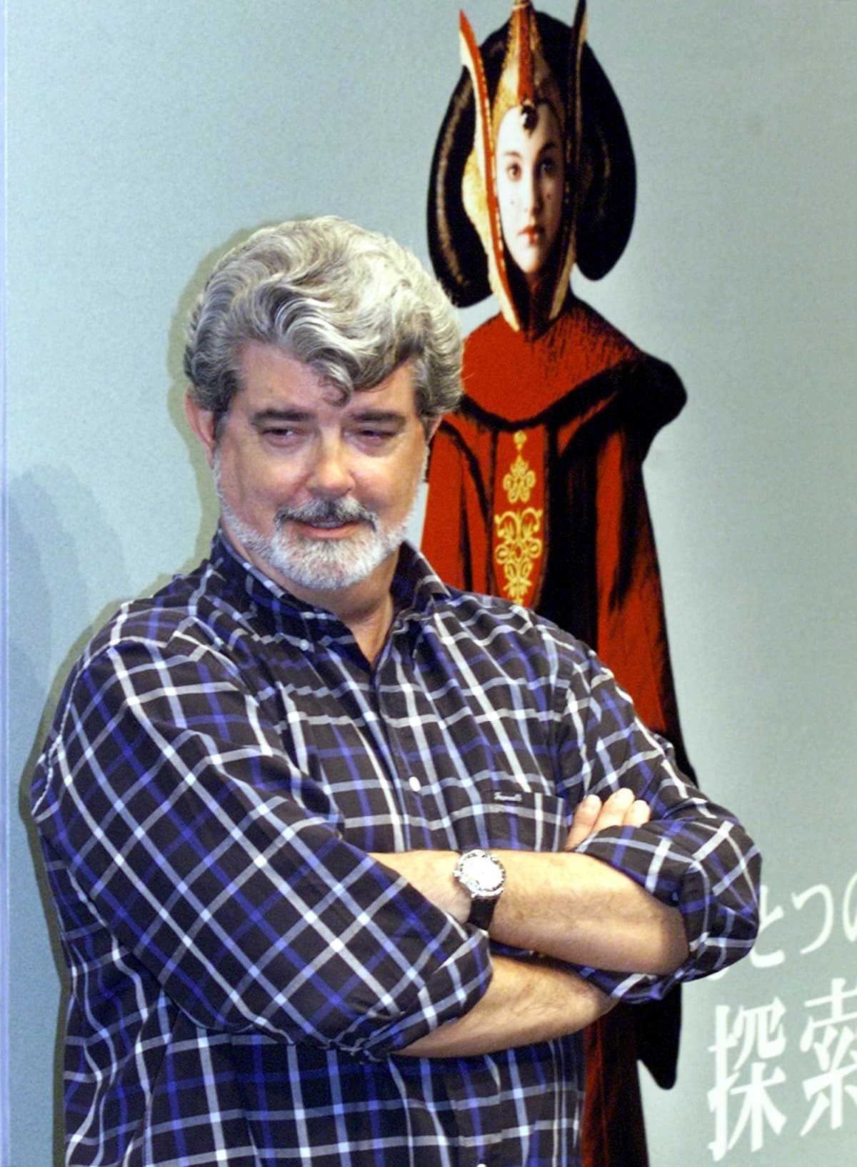 Director George Lucas posing during a news conference while promoting Star Wars: Episode 1 - The Phantom Menace.