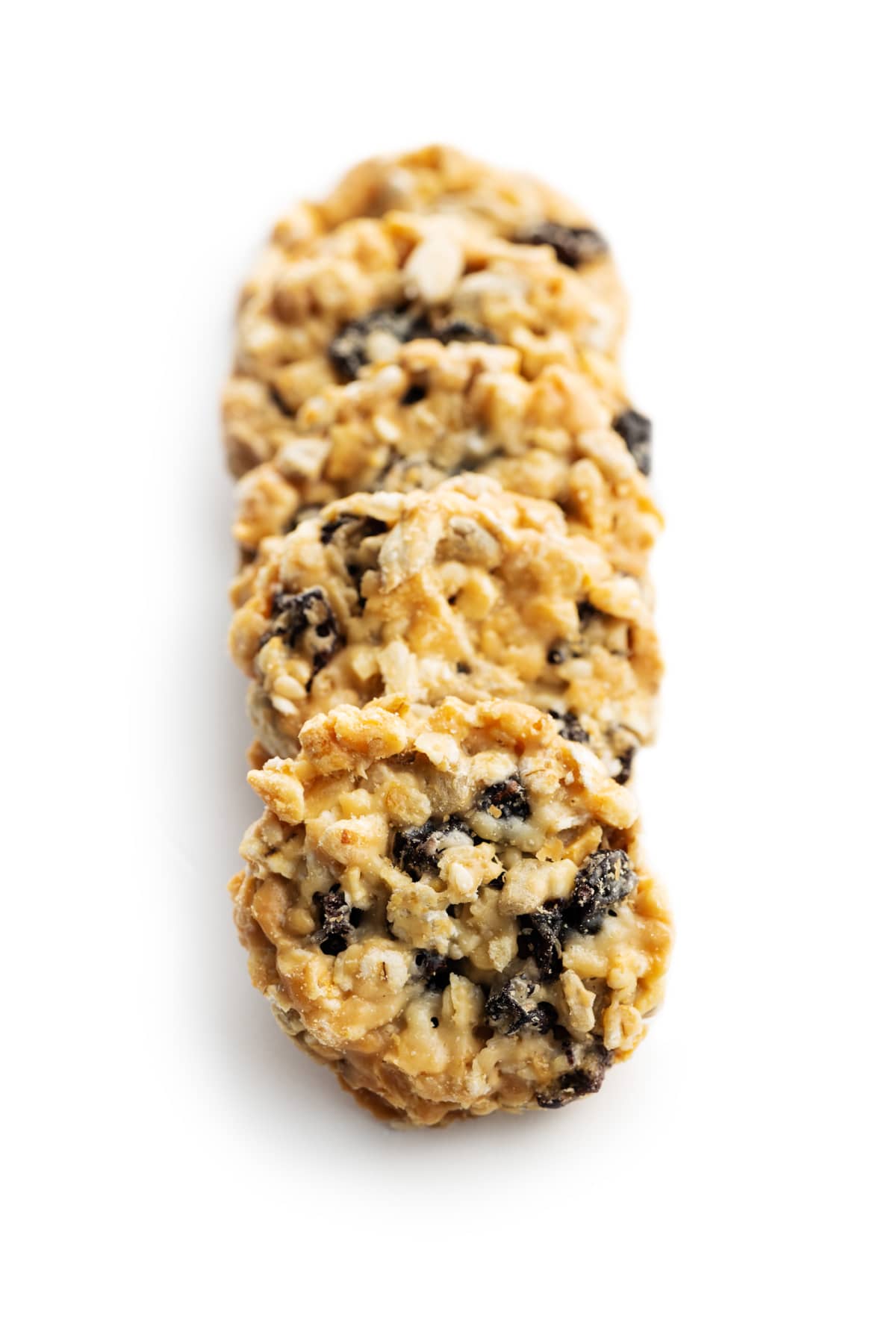 Wholegrain oat cookies. Cookies with oatmeal and raisins isolated on the white table.
