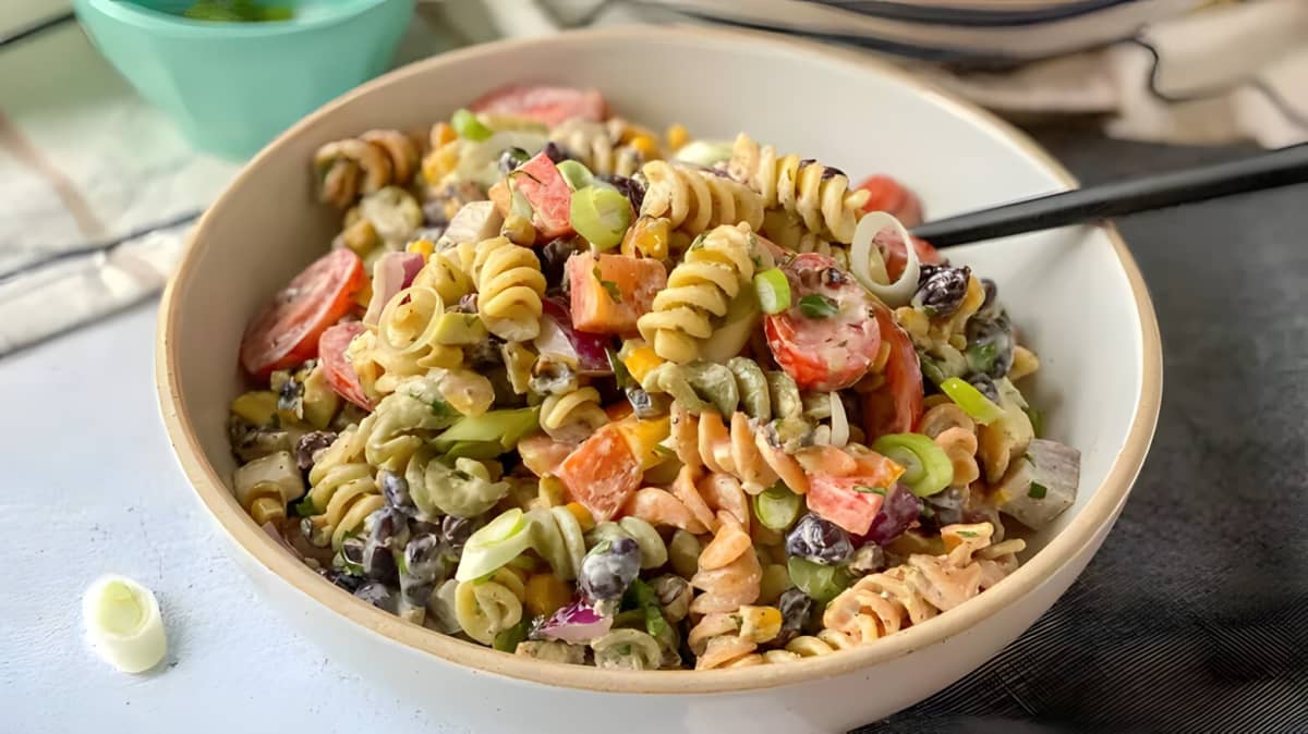Creamy pasta salad with chopped up vegetables