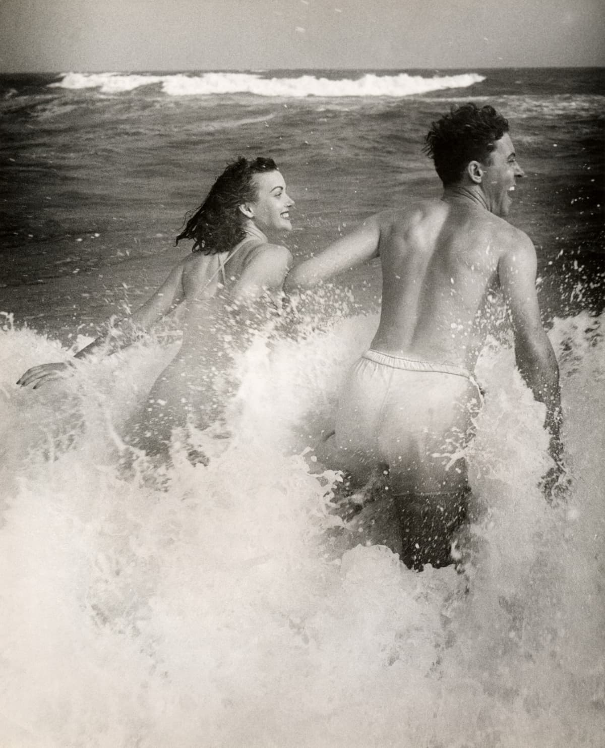 Couple playing in the ocean