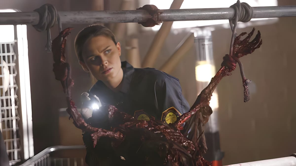 Emily Deschanel as Bones investigating a rotten corpse in Bones