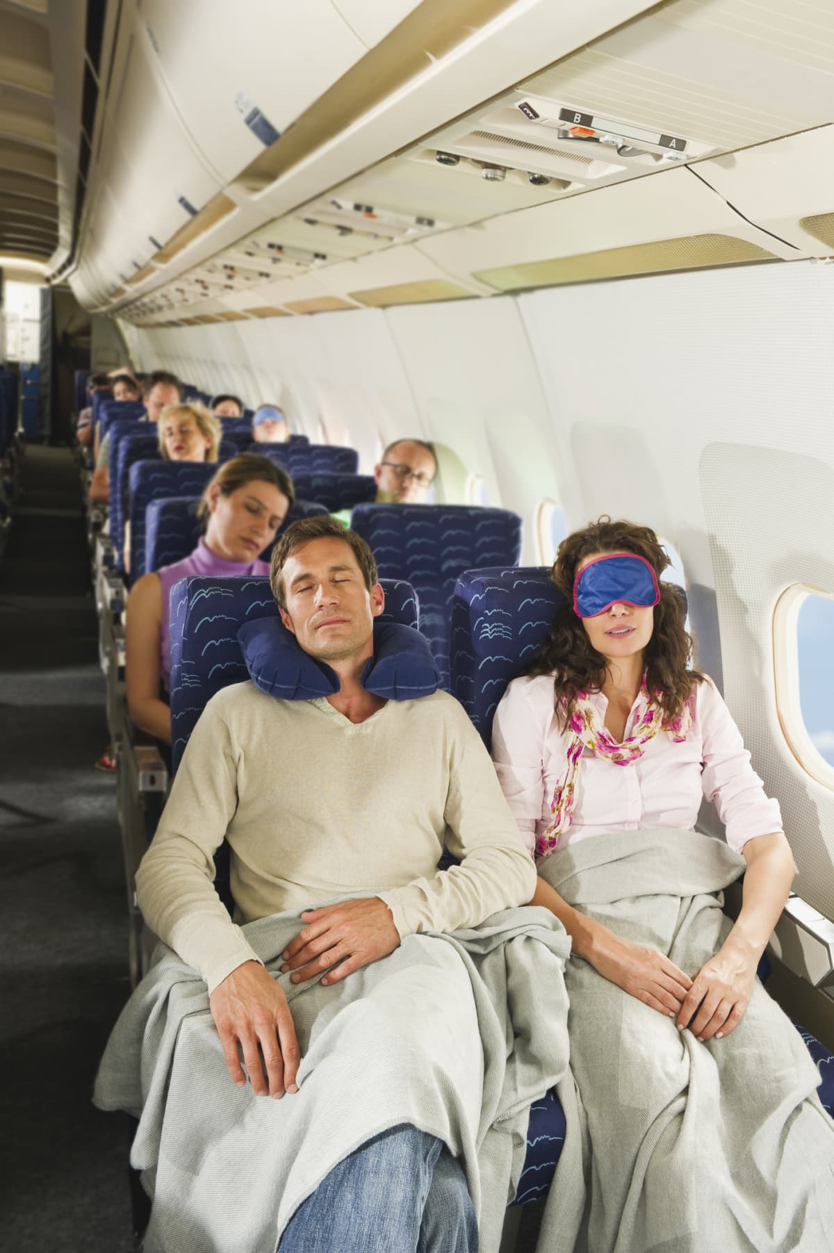 Passengers resting on a plane
