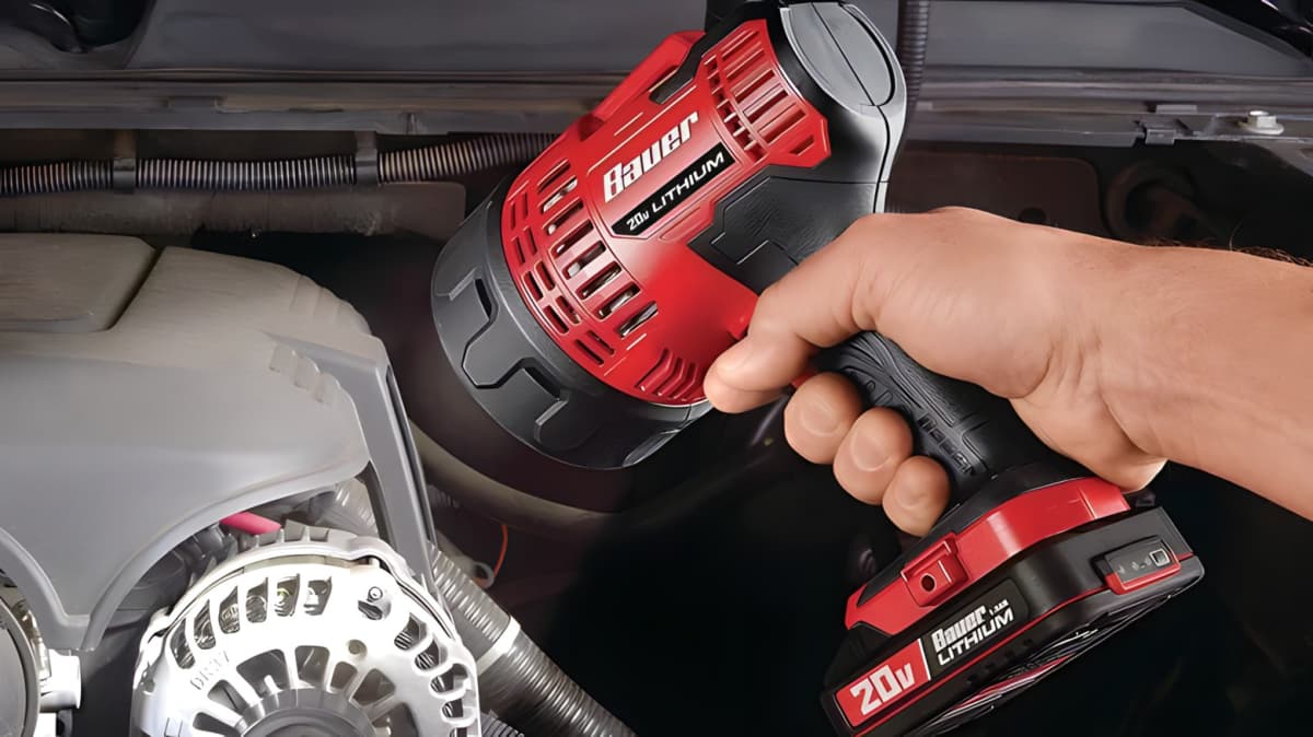 Hand using a Bauer power tool