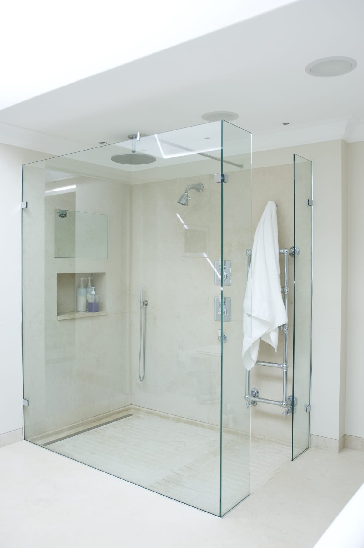 A glass walled shower stall