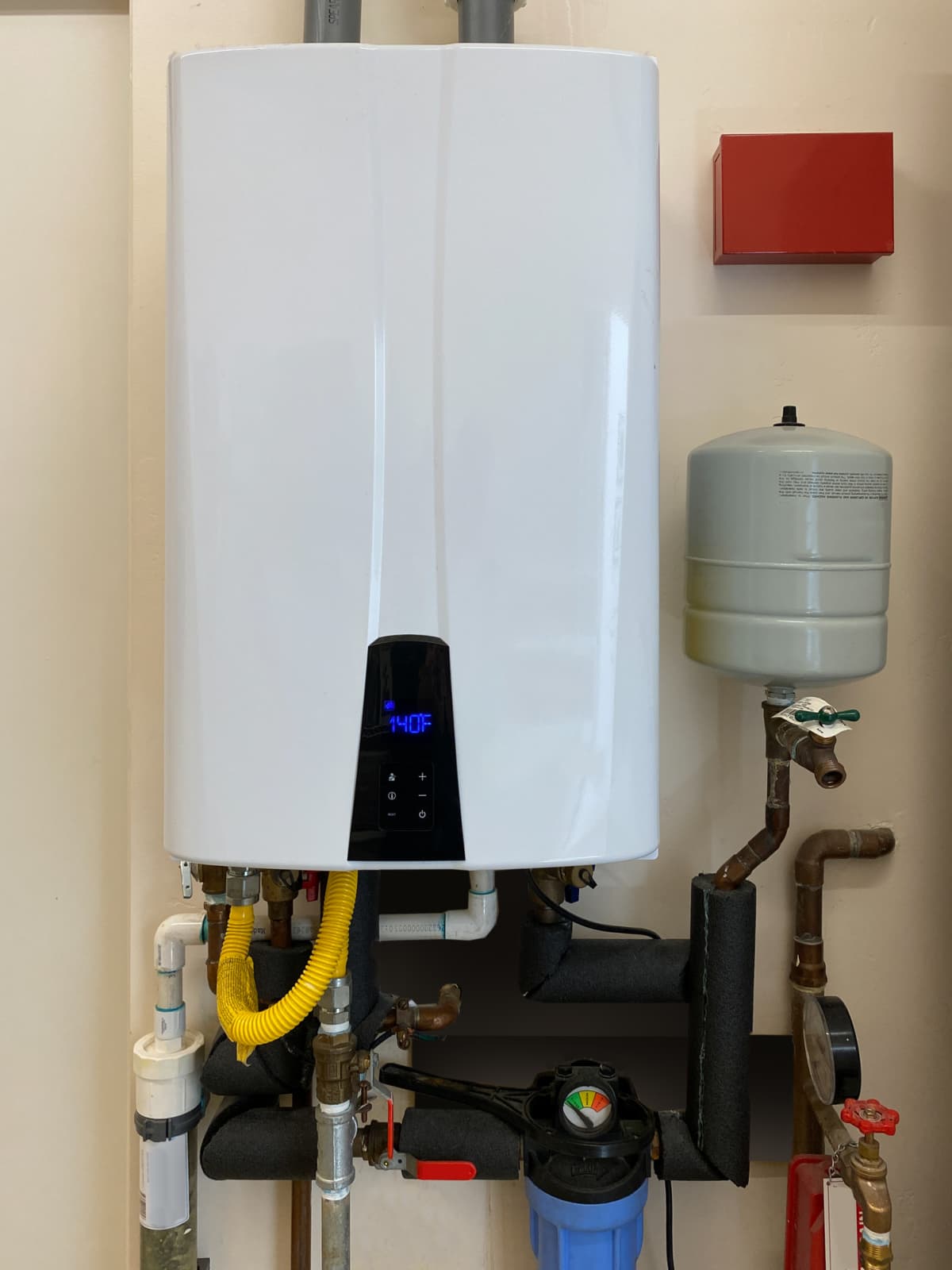 A tankless hot water heater set at 140 degrees Fahrenheit
