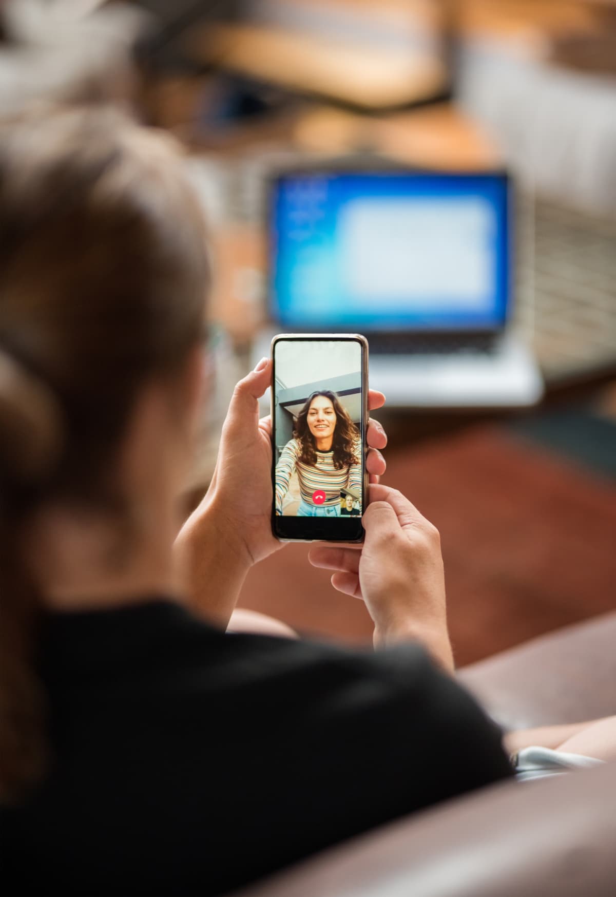 A person having a video chat with their partner.