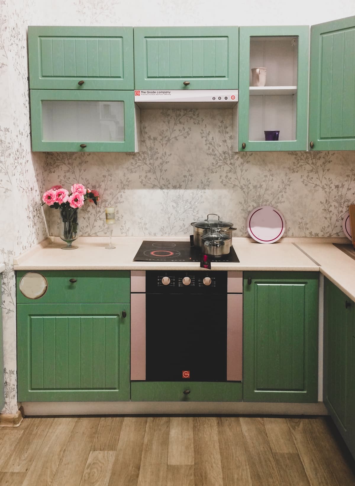 Kitchen with light green cabinets